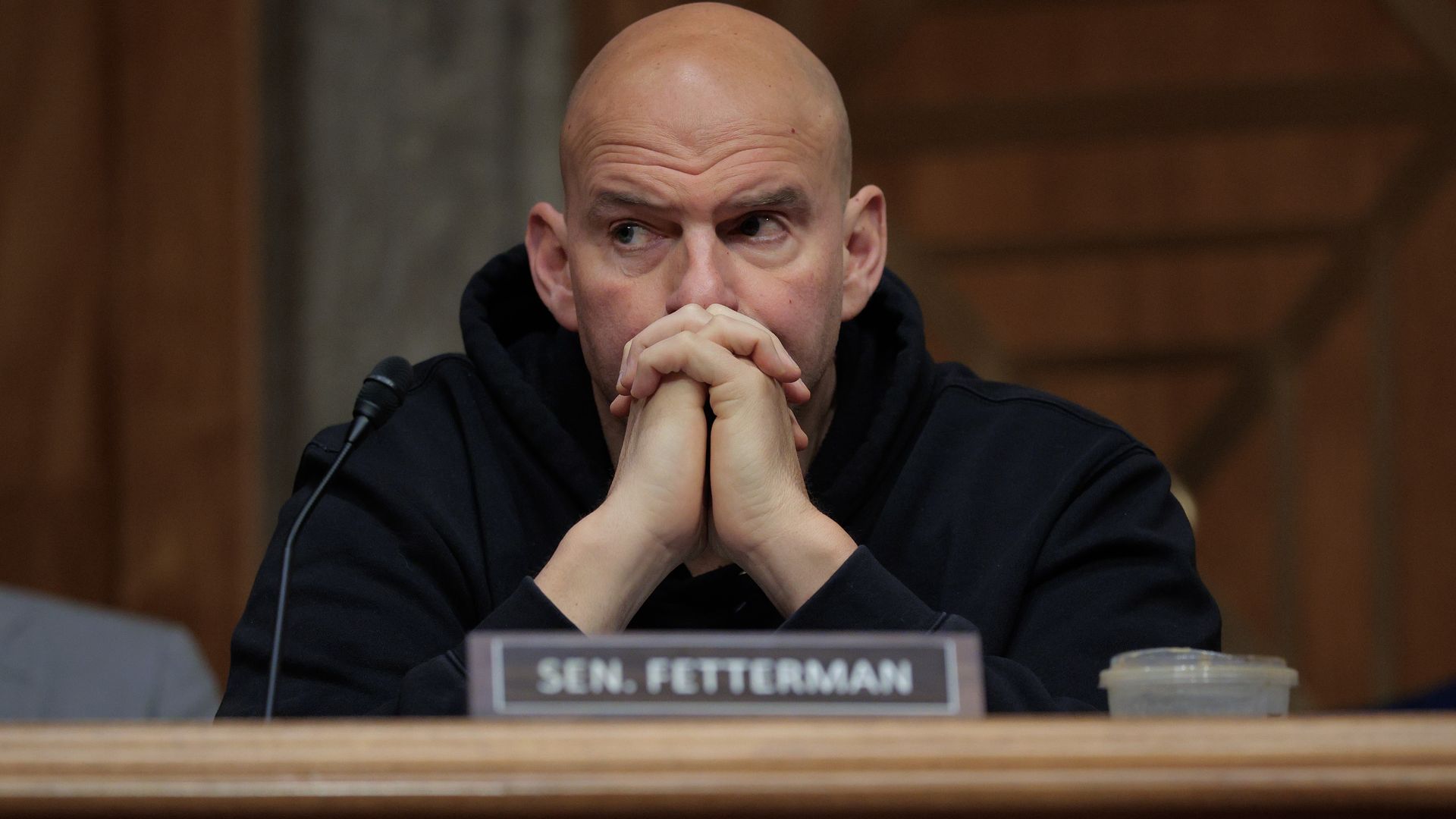 Senate Homeland Security and Governmental Affairs Committee member Sen. John Fetterman (D-WV) votes to advance Sen. Markwayne Mullin.