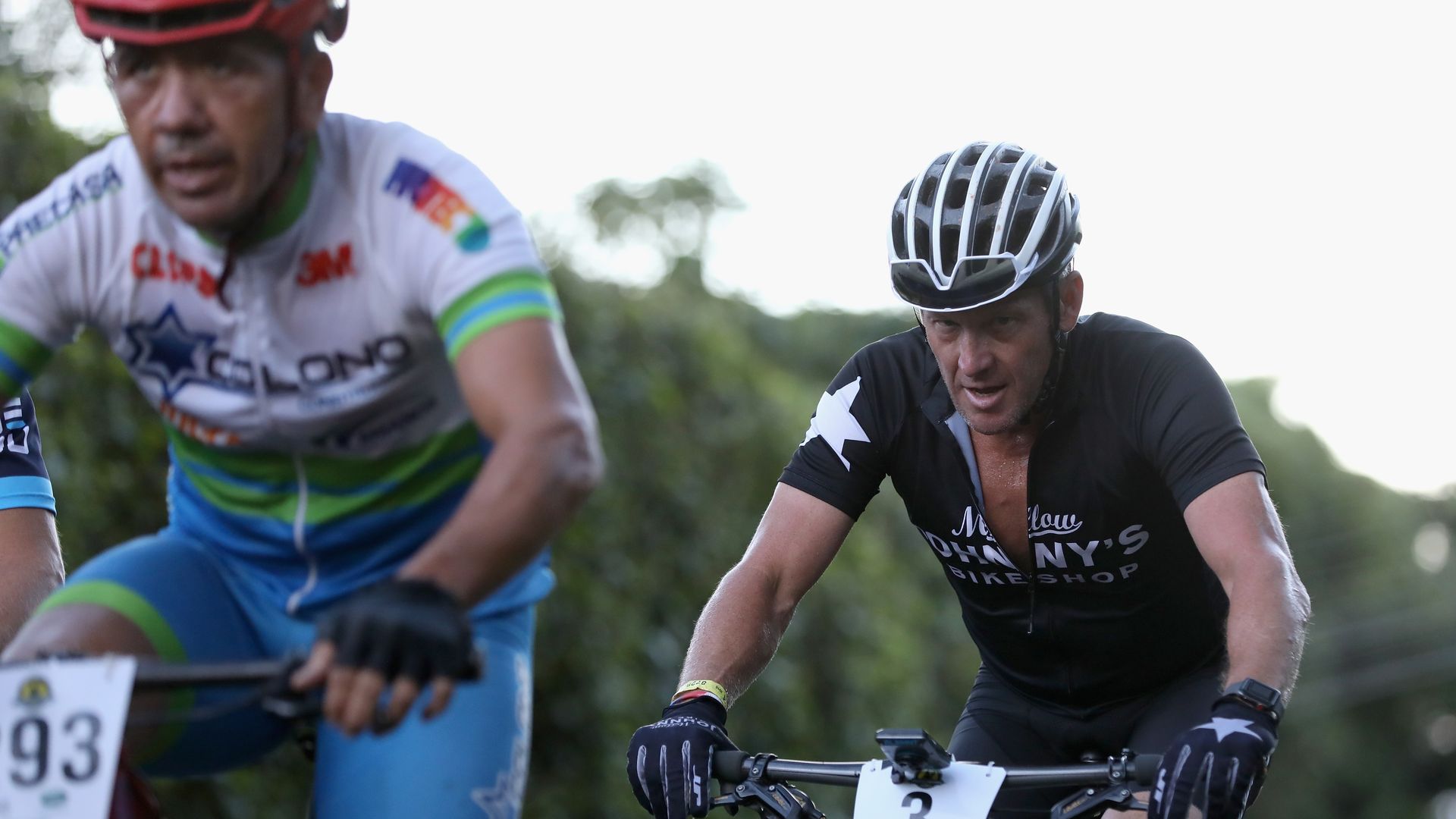 Lance Armstrong pedals up a mountainside in Costa Rica.