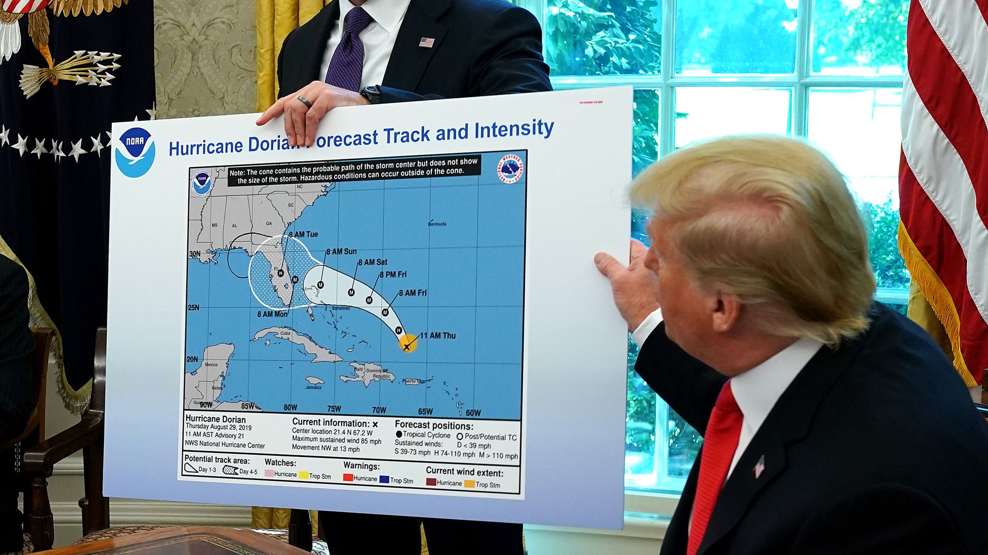 President trump holding doctored map of Dorian