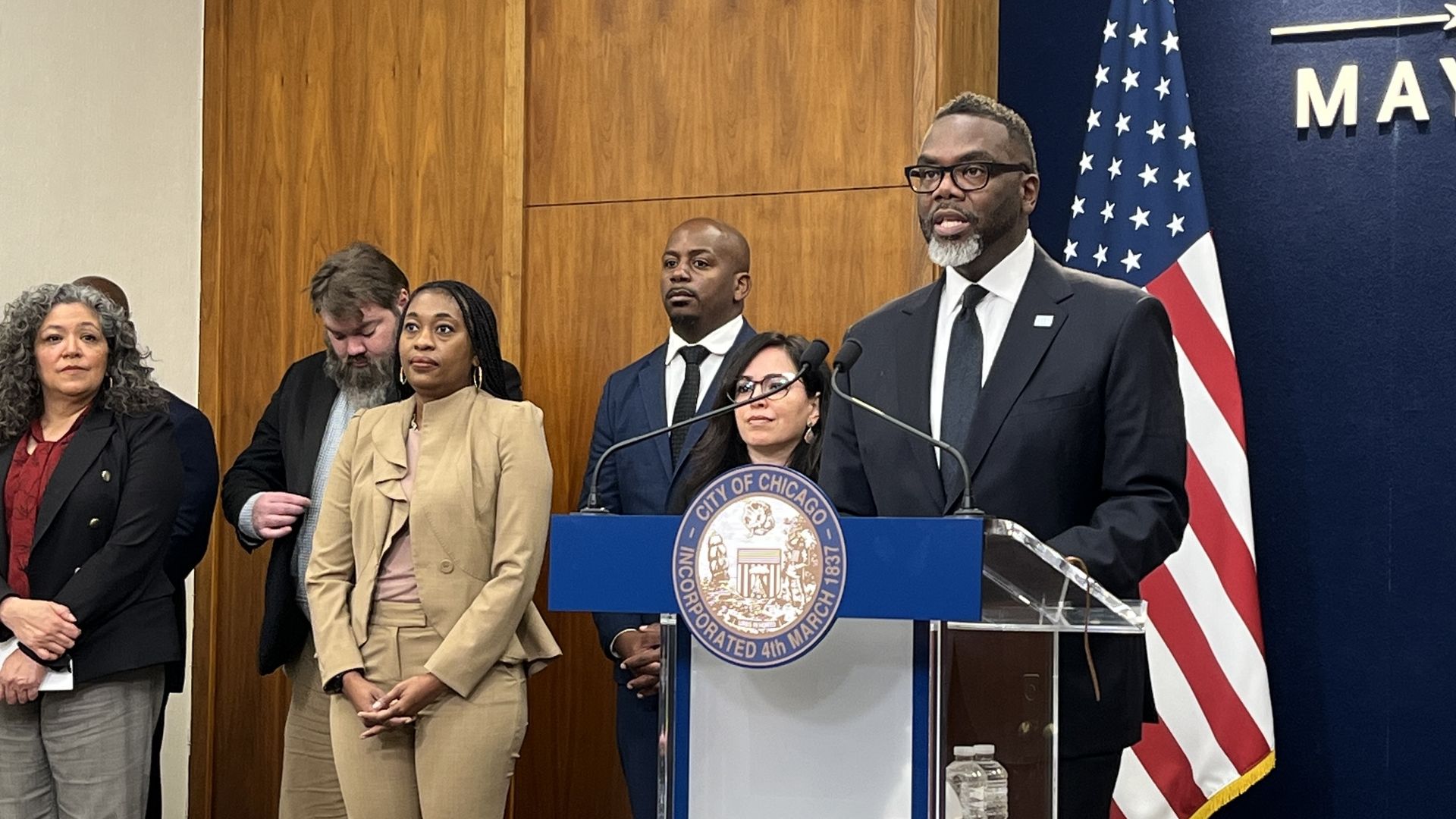Politicians at a podium 