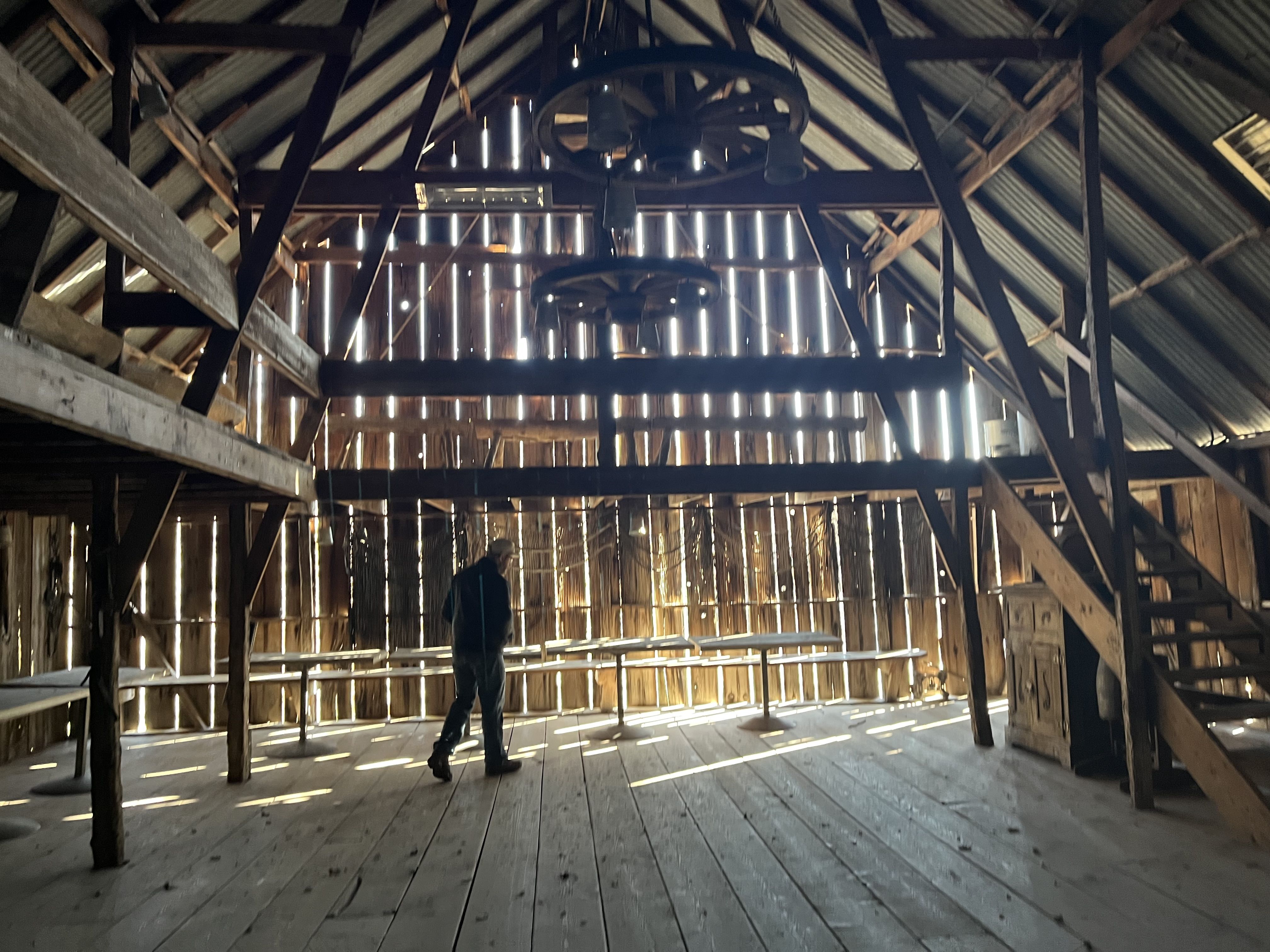 The inside of a dance barn with light shining through