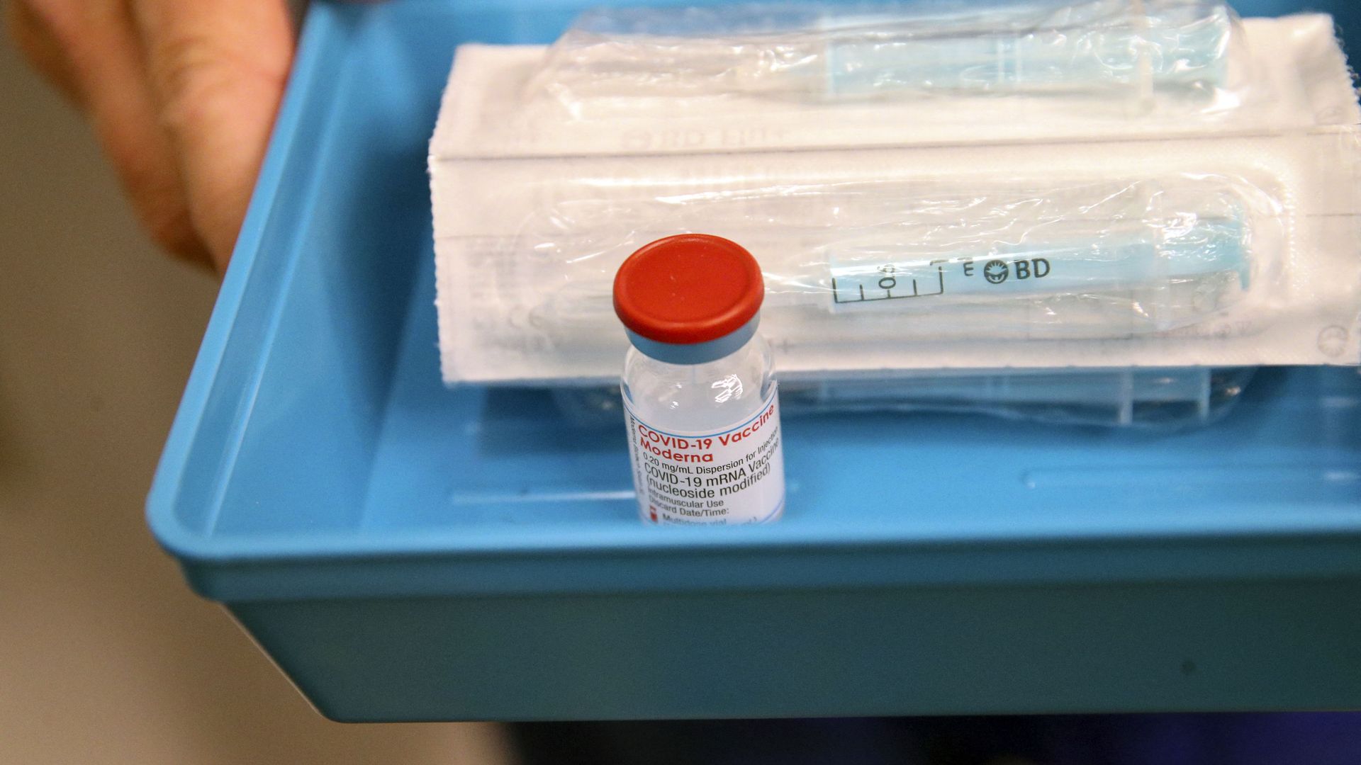 Photo of a tray holding the Moderna vaccine and needle