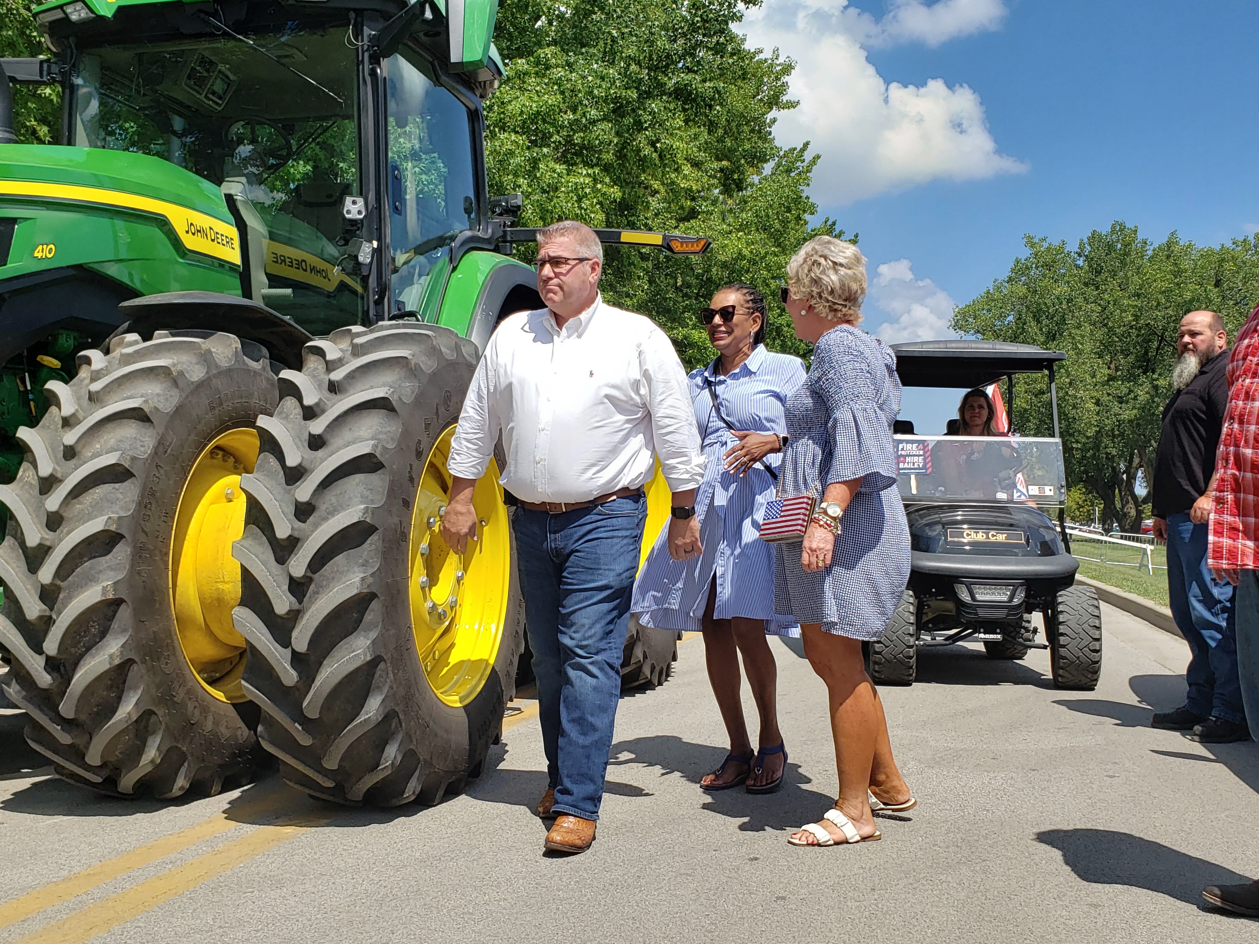 guy next to a tractor