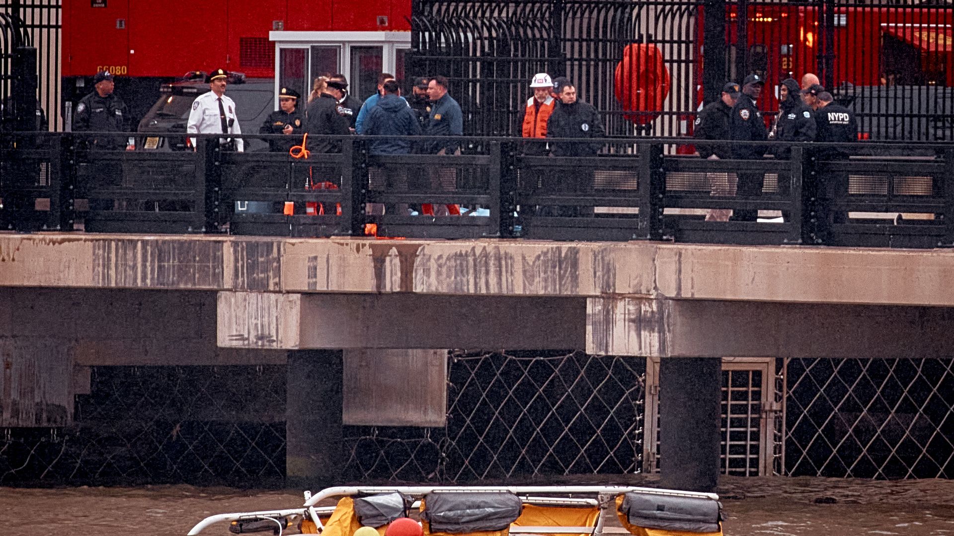  Police and firefighters work on the site after a helicopter crashed in the Hudson River on April 10, 2025 in Jersey City, New Jersey. 