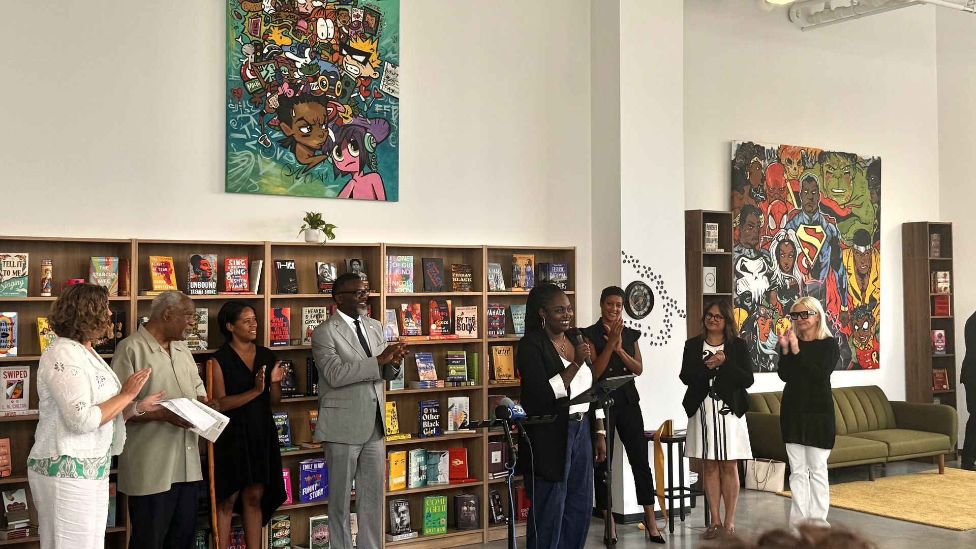 Danielle Moore speaking at the opening of Semicolon on Michigan Ave.