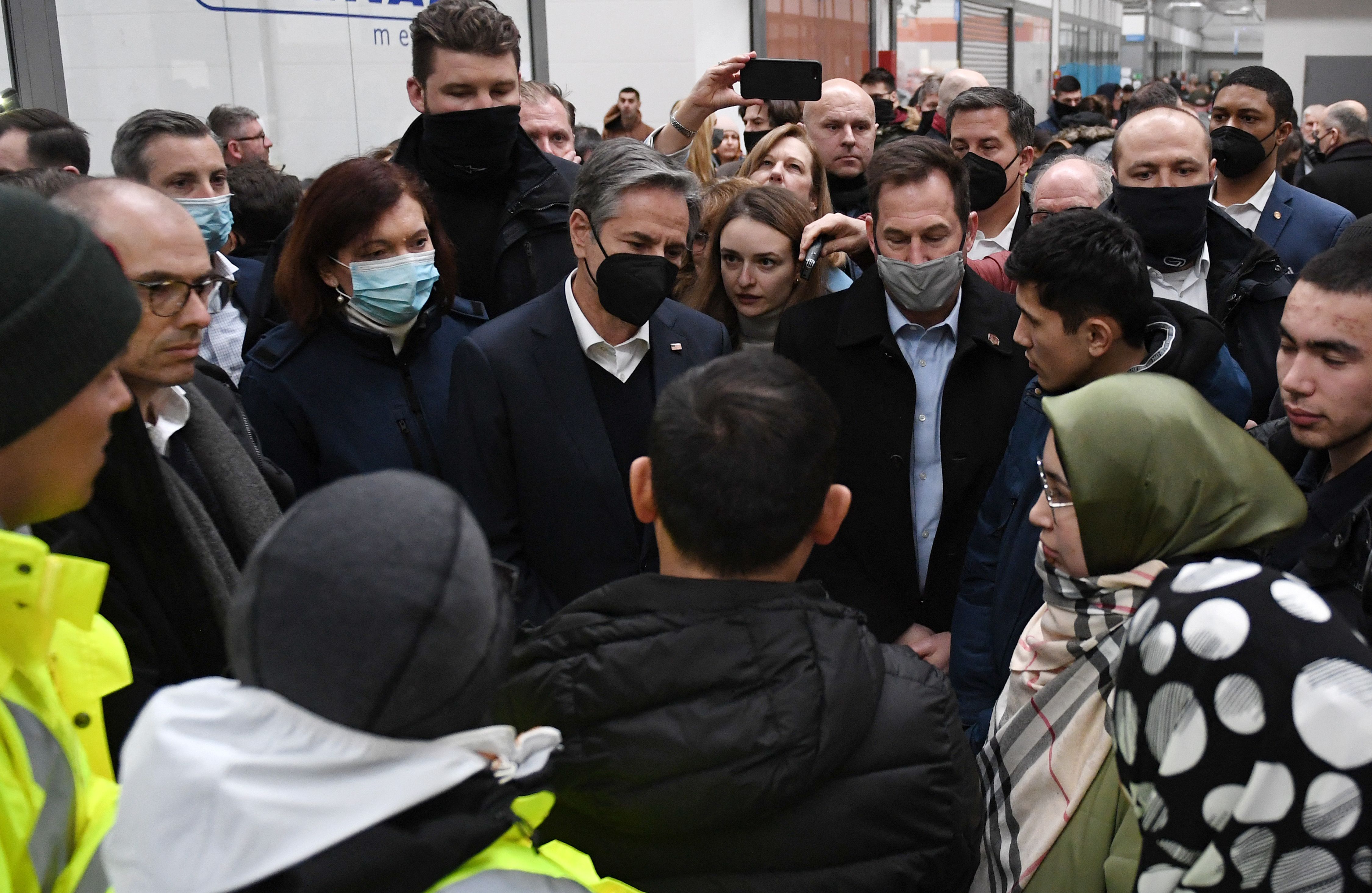 Secretary of State Antony Blinken (C) meets with refugees at a refugee reception center at the Ukrainian-Polish border crossing in Korczowa on March 5, 2022