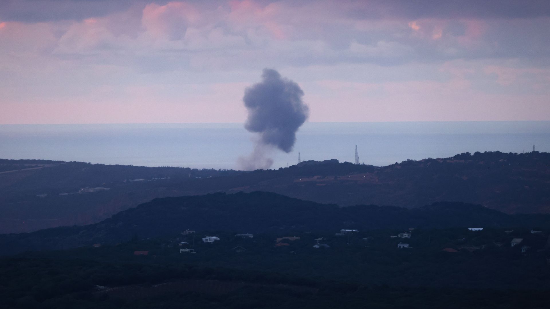 A picture taken from northern Israel on the border with Lebanon shows smoke billowing after an Israeli strike on the southern Lebanese area of Naqura on November 16, 2023