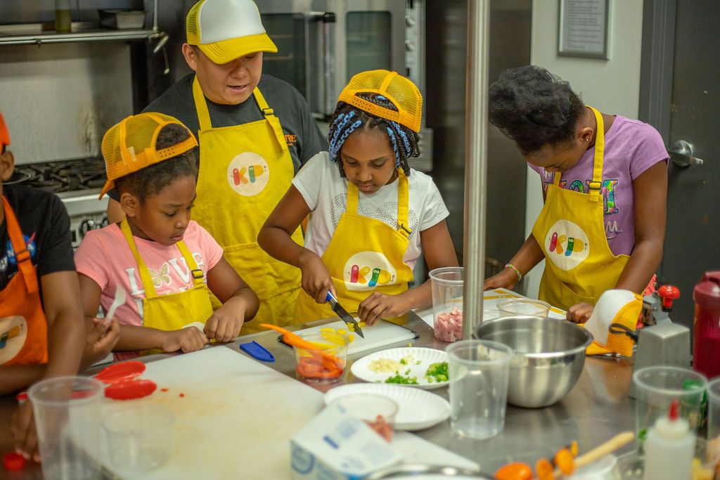 Photo of kids making food 