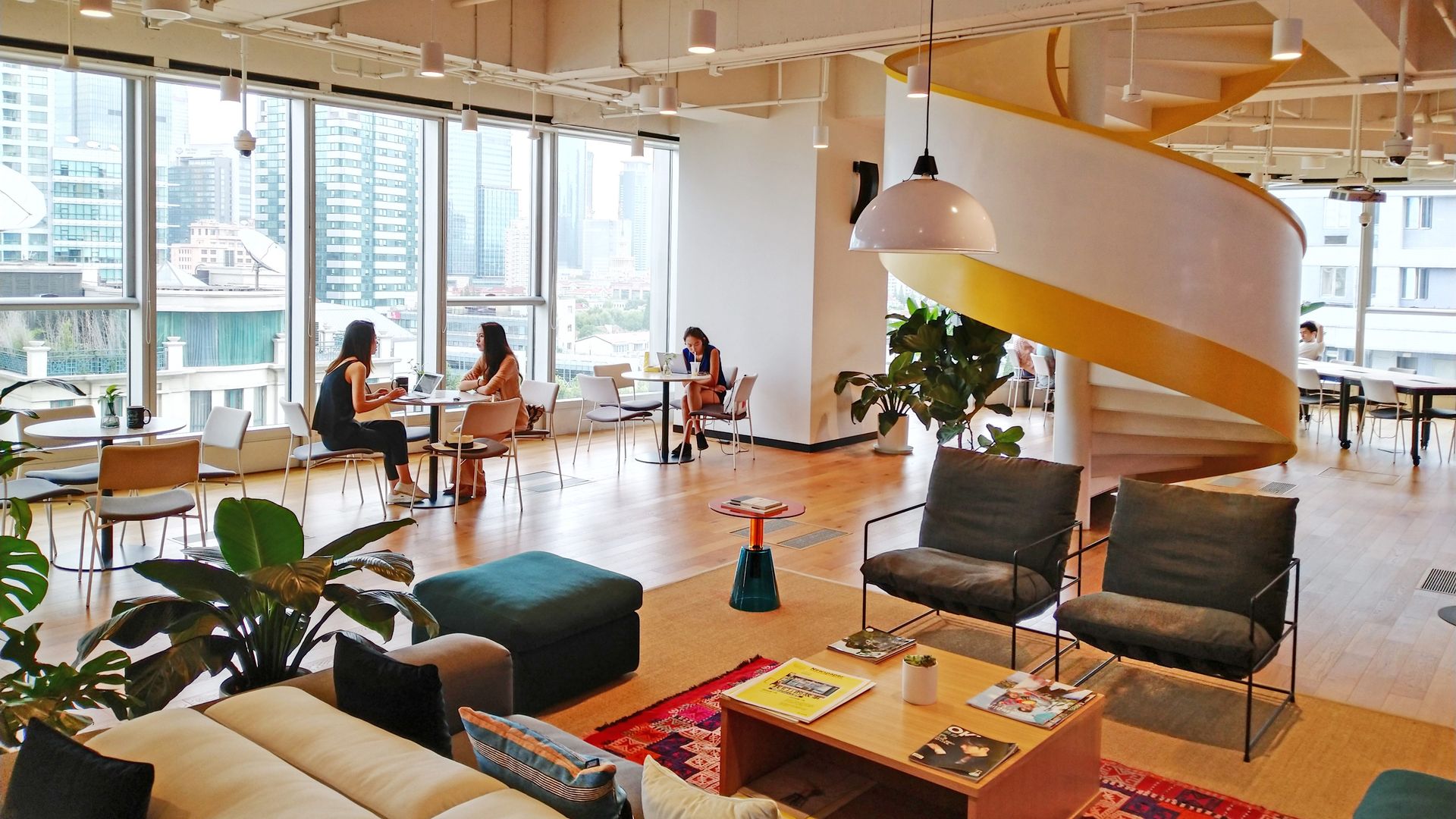 Employees work at a WeWork office in Shanghai, China, Aug. 13, 2019.