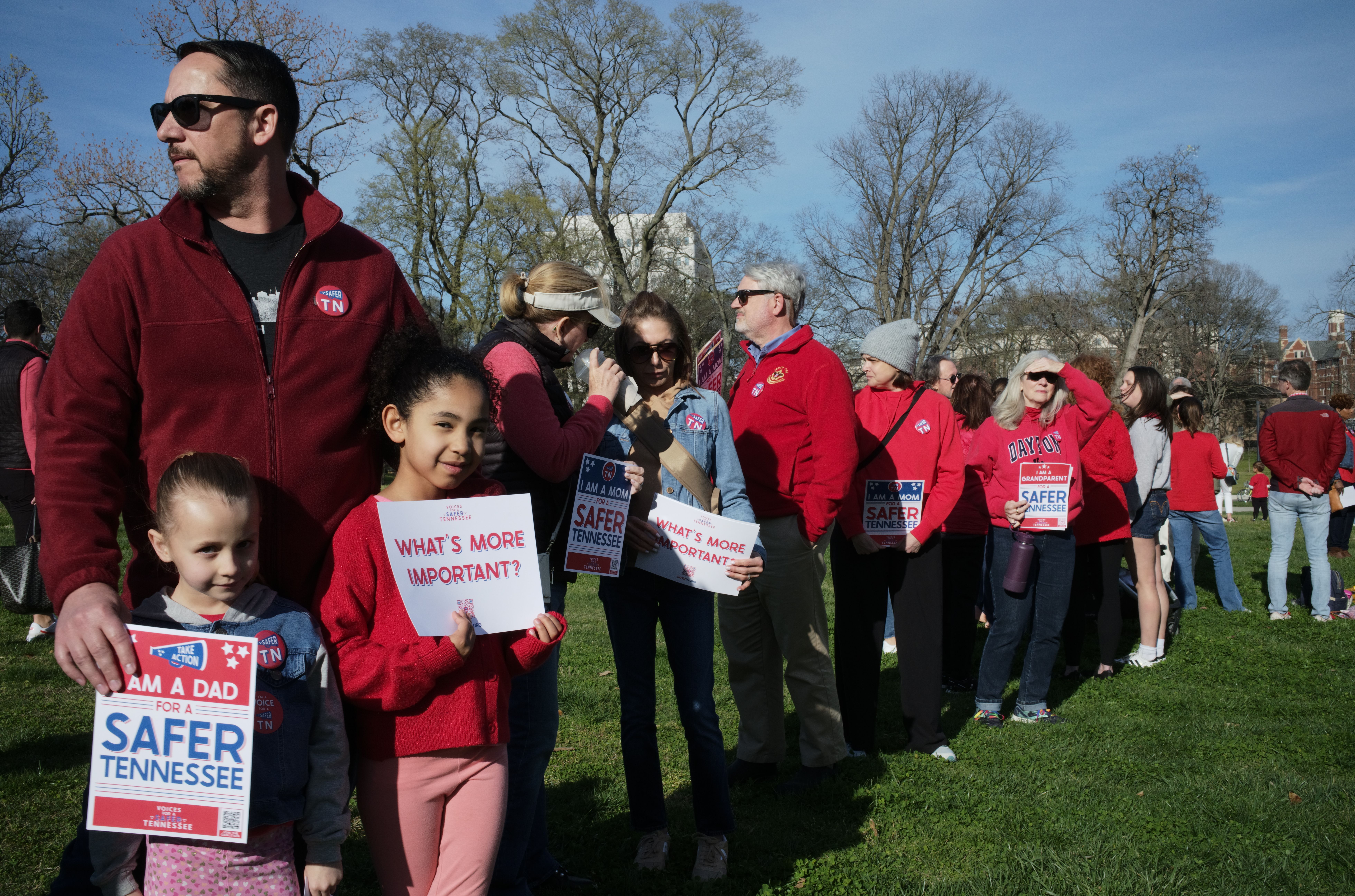 A line of people wearing red.