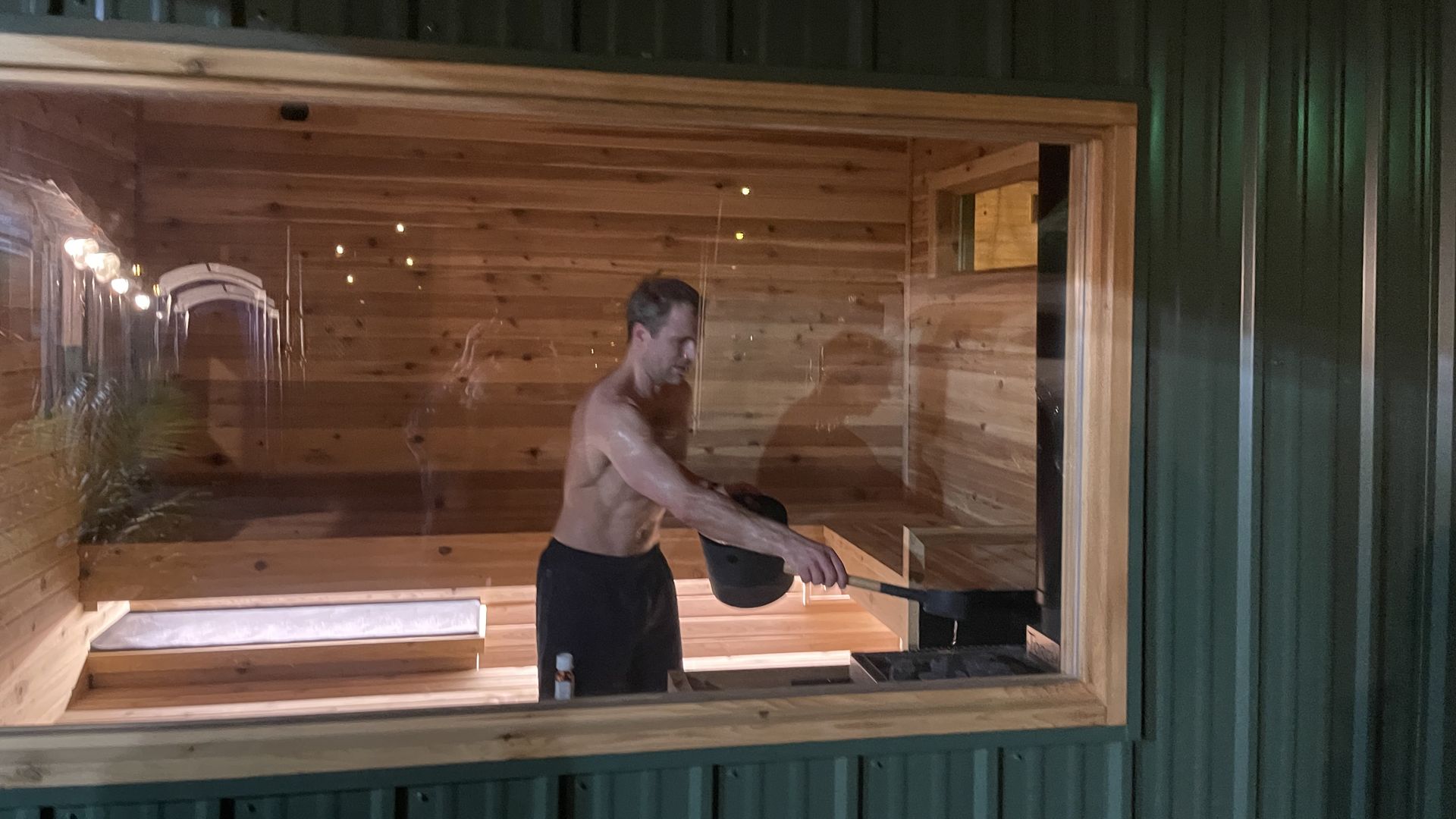 a man stands in a sauna