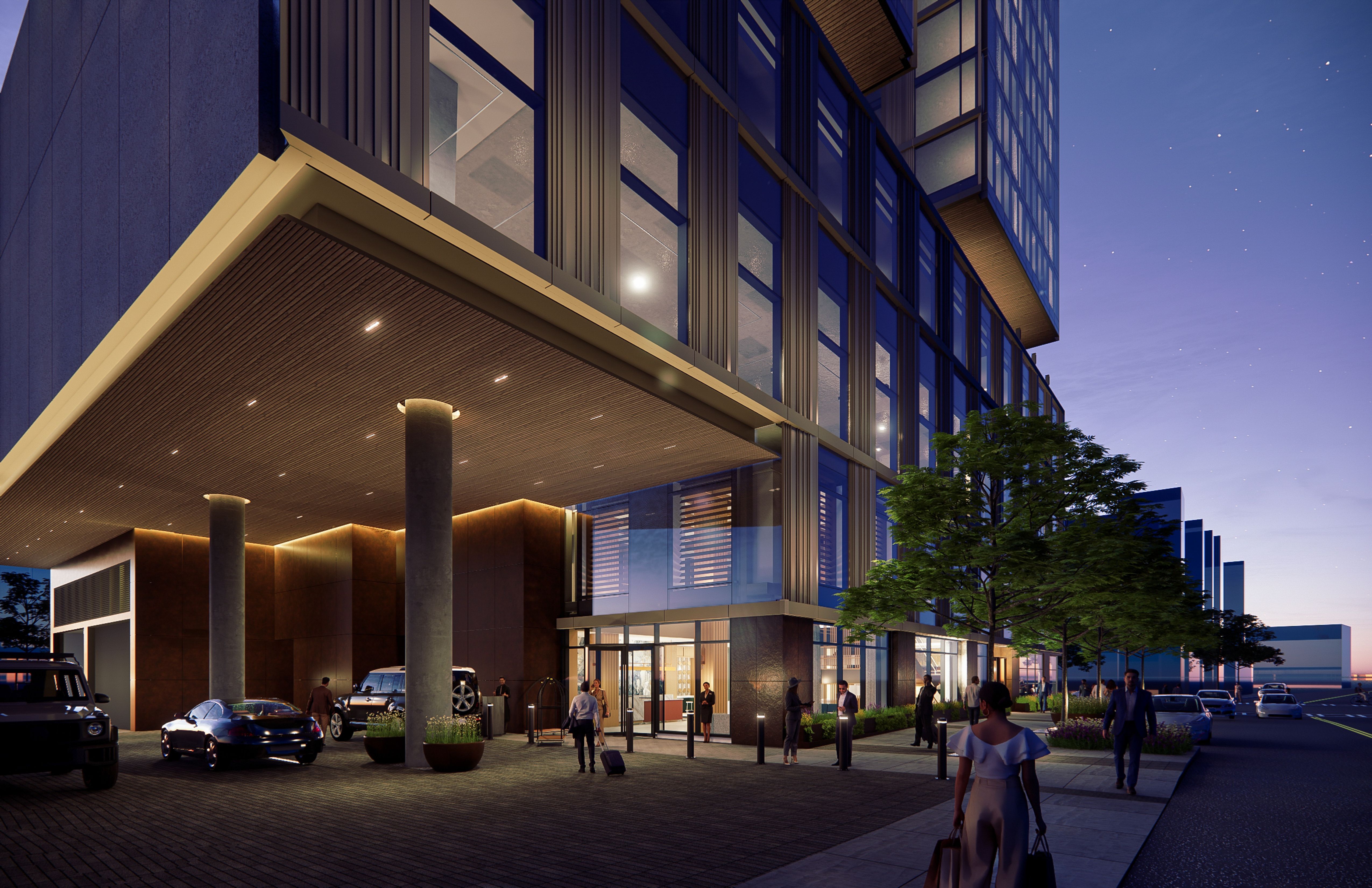 Evening scene of a modern glass office building with a large canopy, tall windows, and concrete columns. People walk near parked cars beneath a blue twilight sky.