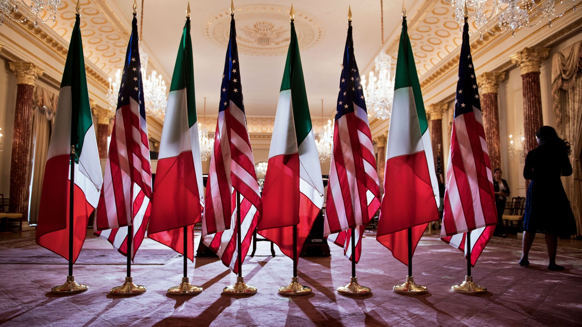 U.S. and Mexico flags stand side-by-side.