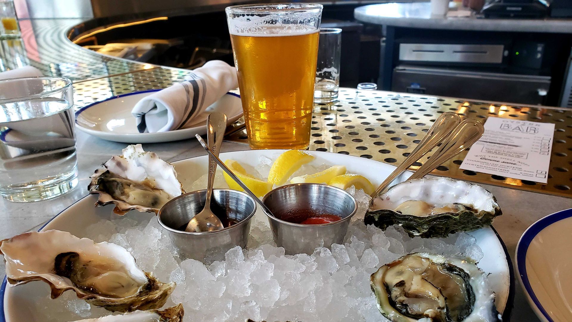 Draft beer and oysters at Swift & Sons Tavern in Chicago