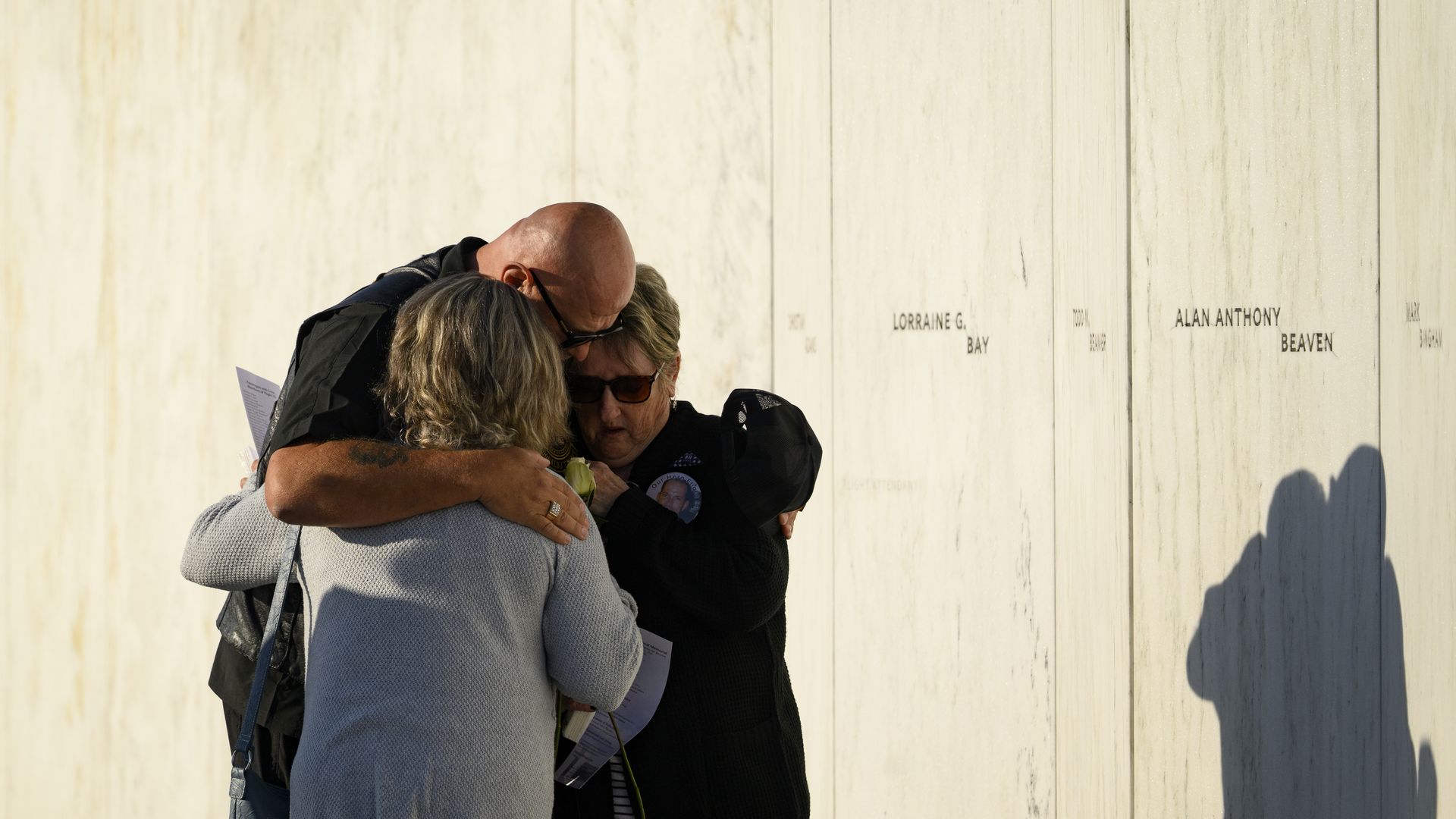 Relatives of Mark Bingham gather in front of his name on the Wall of Names memorial to the passengers of Flight 93 on Sept. 11 in Shanksville, Pa. 
