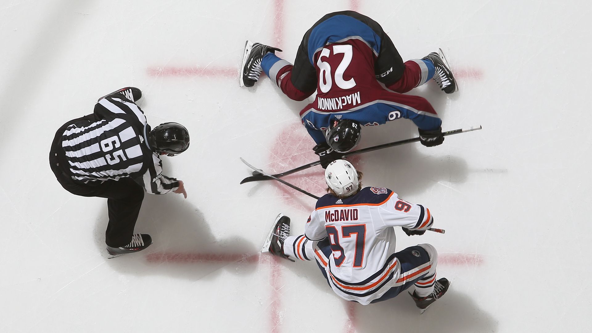 Connor McDavid facing off against Nathan MacKinnon