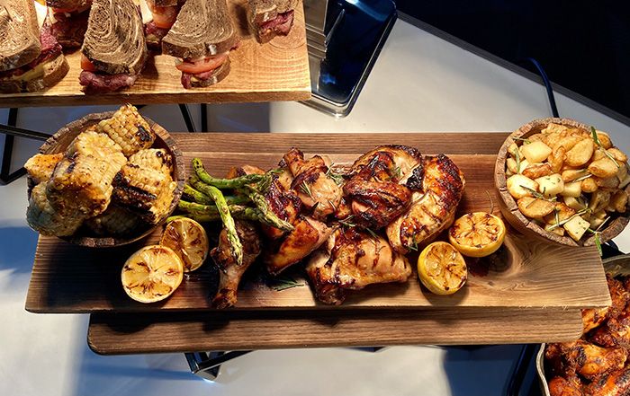 Lemon chicken board: marinated grilled chicken with little gem potatoes and grilled vegetables. Photo: Ashley Mahoney/Axios 