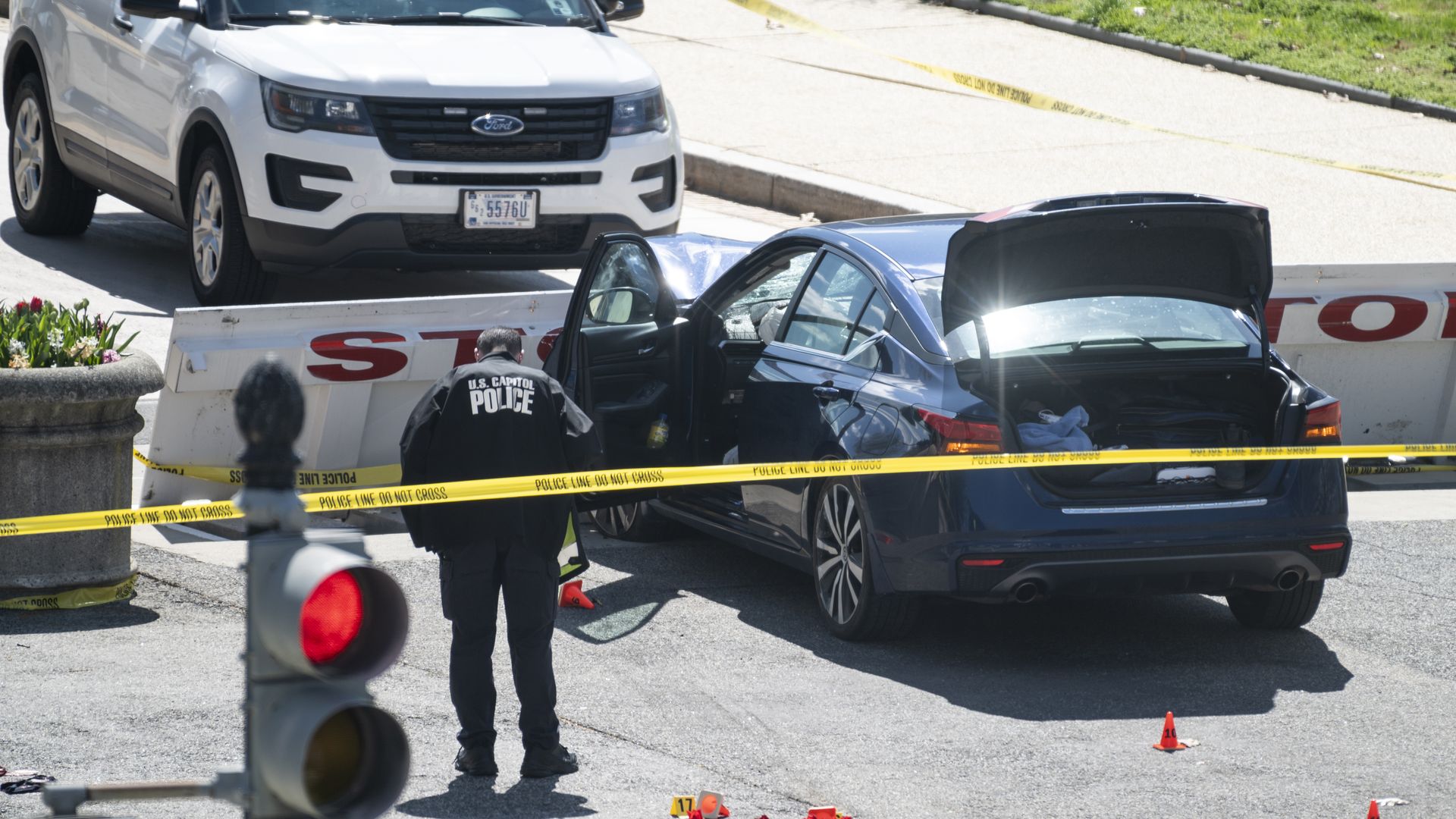 Police investigating the scene where a driver drove into a security barrier near the U.S. Capitol on April 2.