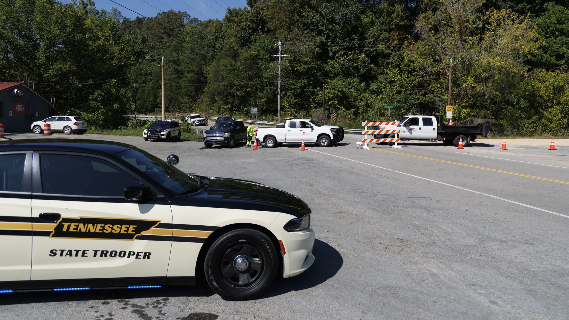 Police and Department of Transportation workers block the road leading to Accurate Energetic Systems