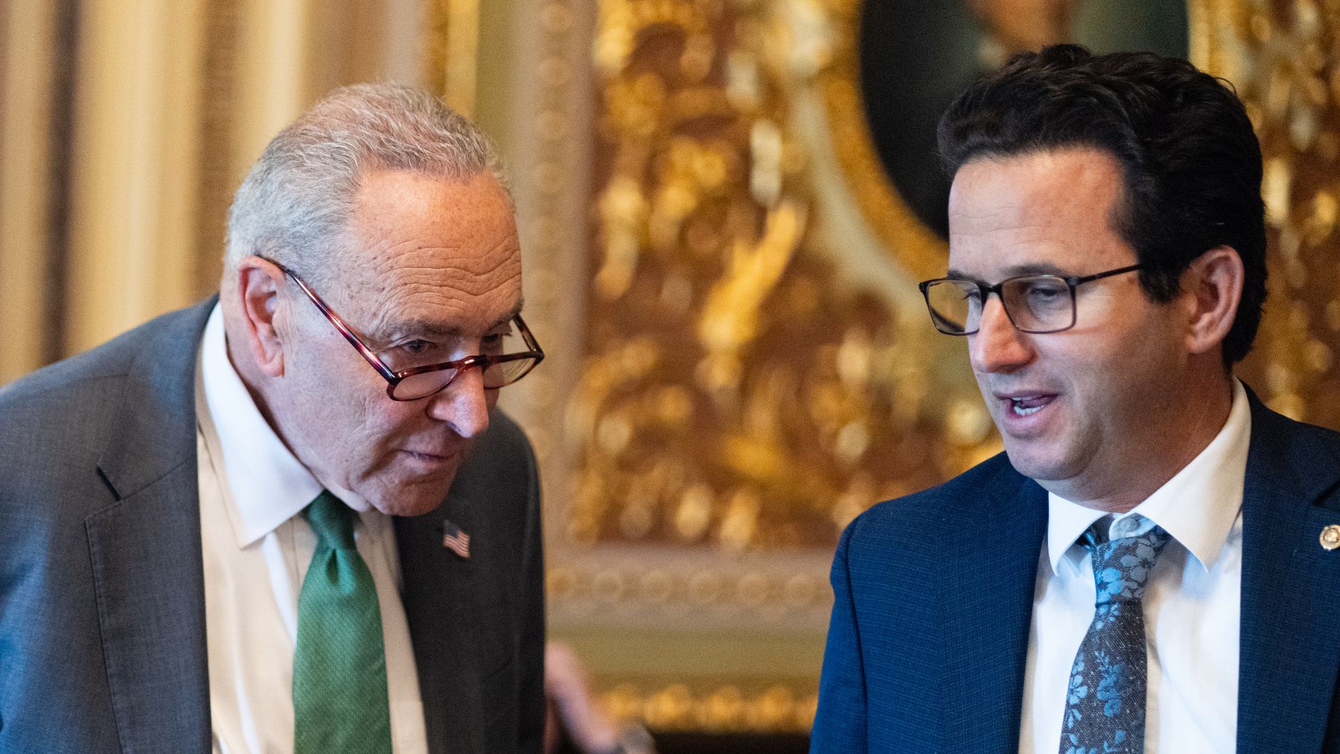 Senate Minority Leader Chuck Schumer and Sen. Brian Schatz talk as they leave Democrats' lunch meeting in the U.S. Capitol on June 10, 2025. 