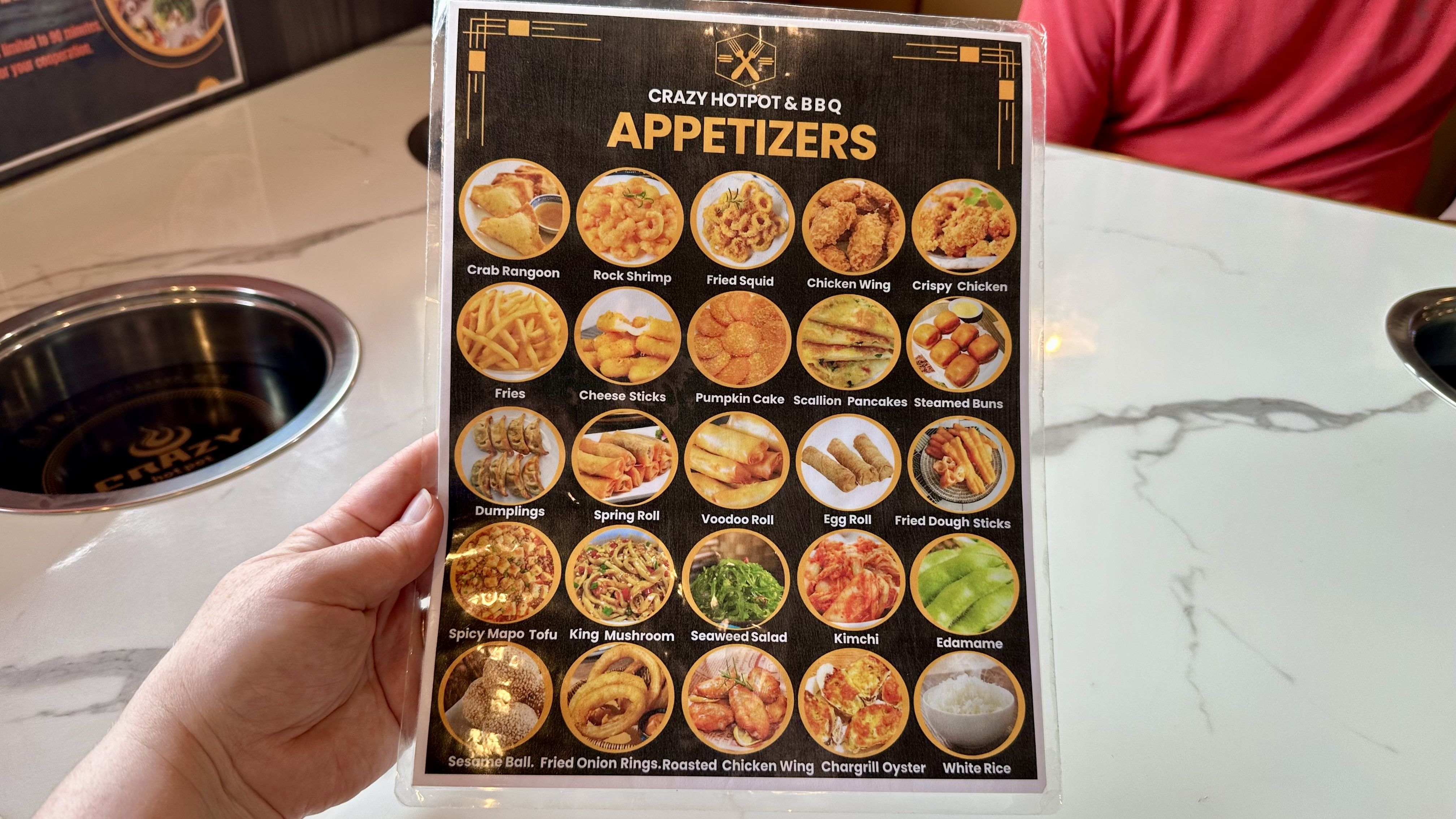 Photos shows the appetizer menu at Crazy Hot Pot.