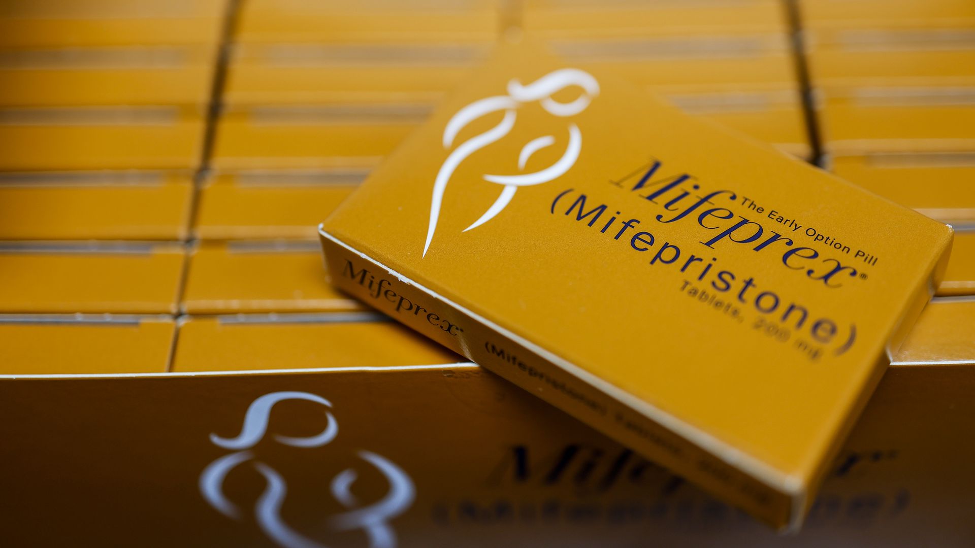 A carton of orange Mifepristone boxes 