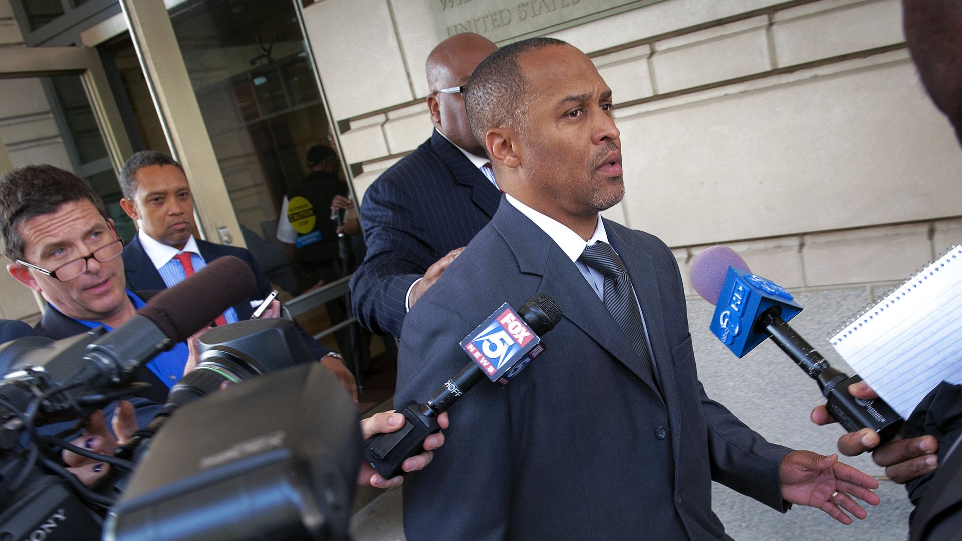 Harry Thomas, Jr., former Ward 5 city councilman, departs the courthouse after being sentenced for stealing $350,000 in earmarked city funds.