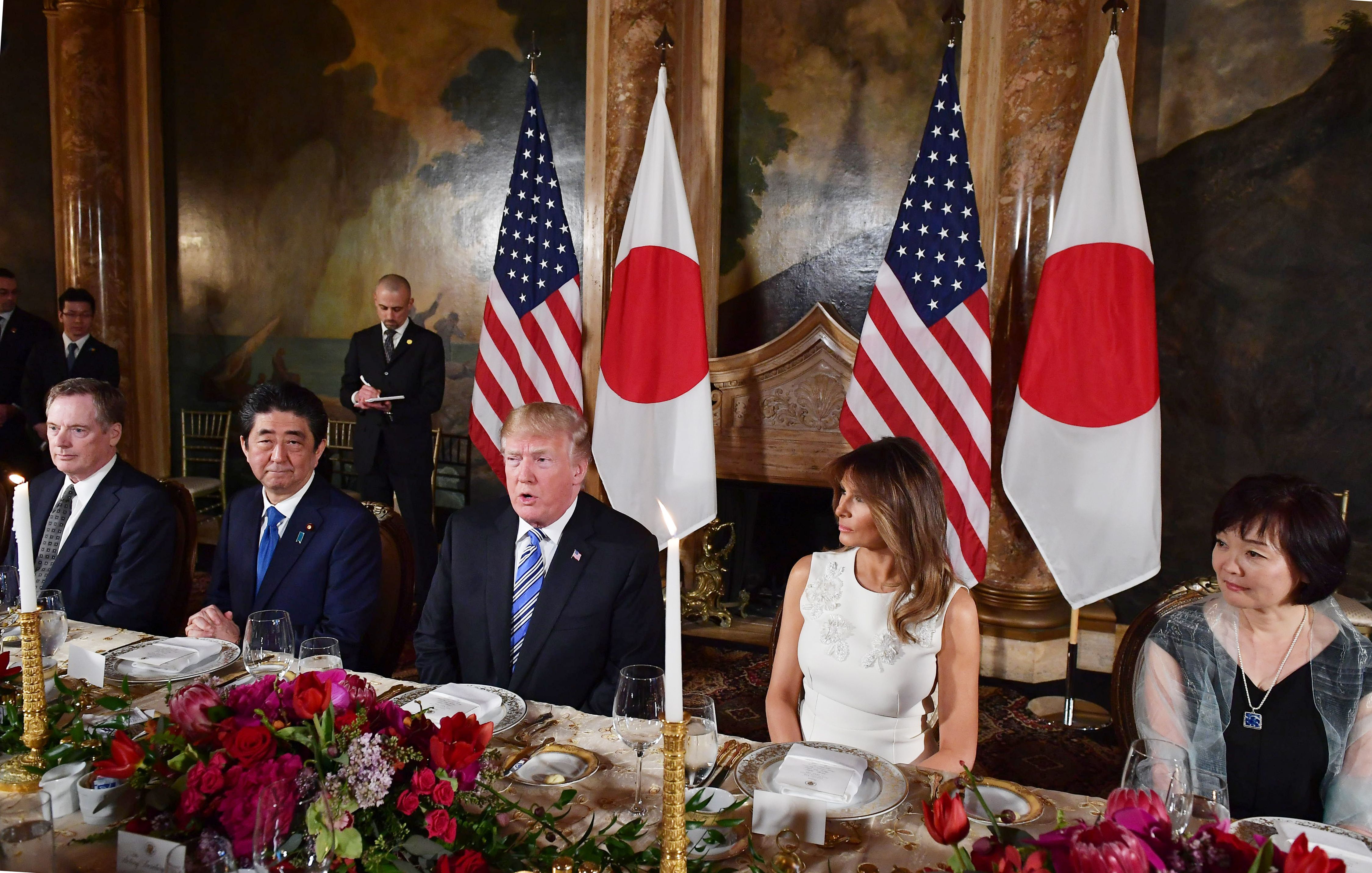 Shinzo Abe and Donald Trump at table in Mar-A-Lago.