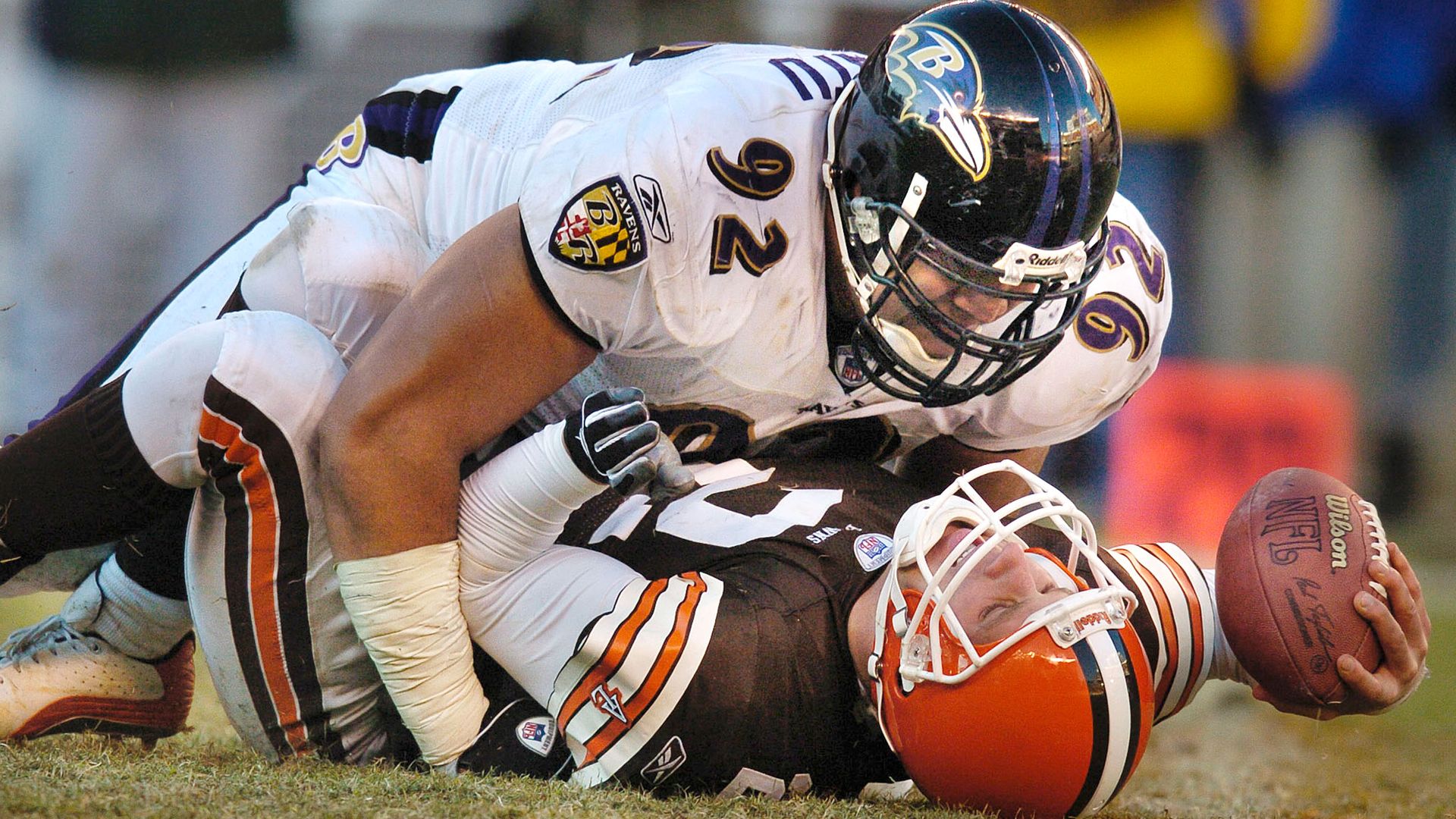 Browns quarterback Tim Couch getting pancaked by a Baltimore Ravens defender