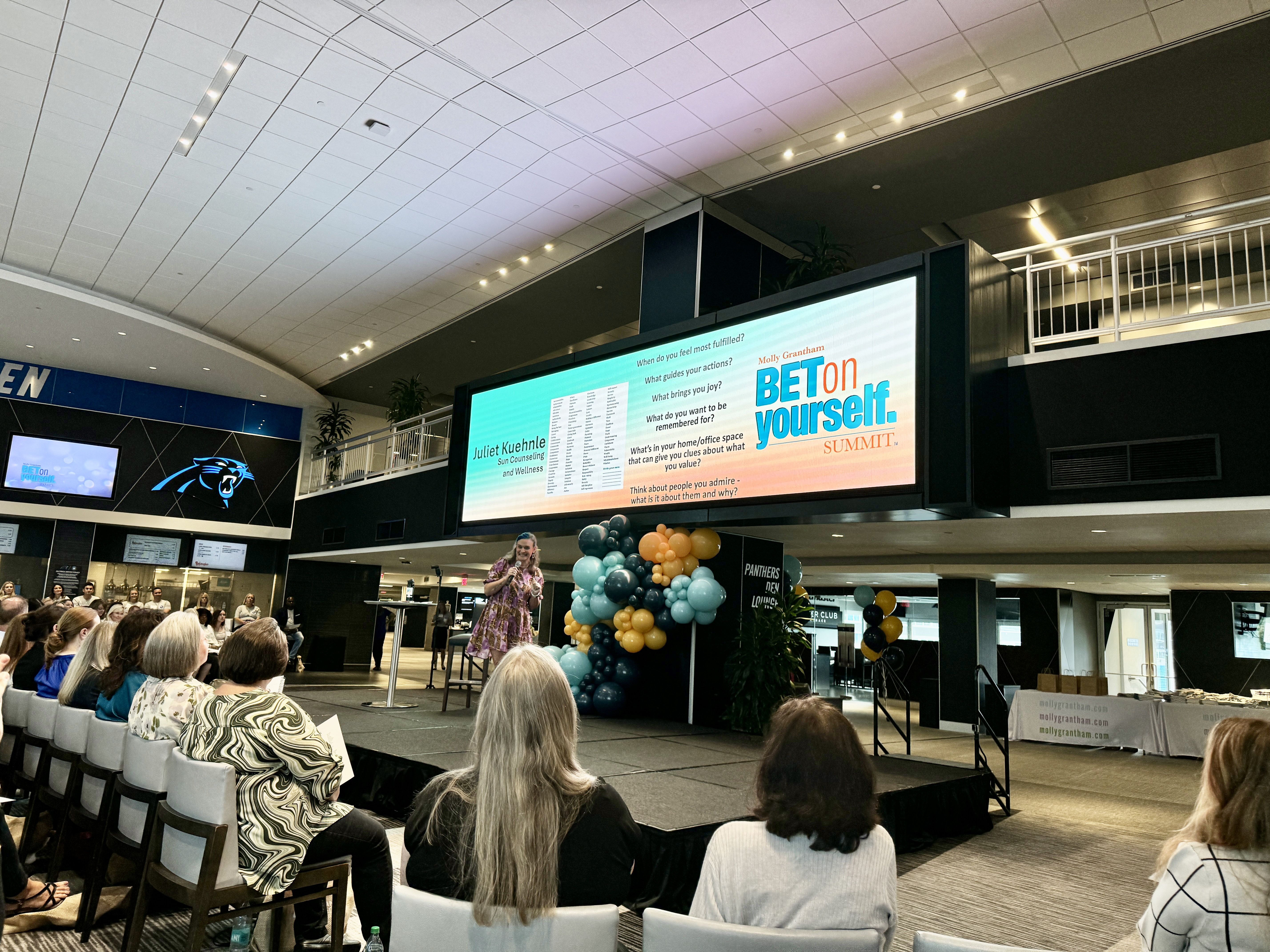 woman talking on stage