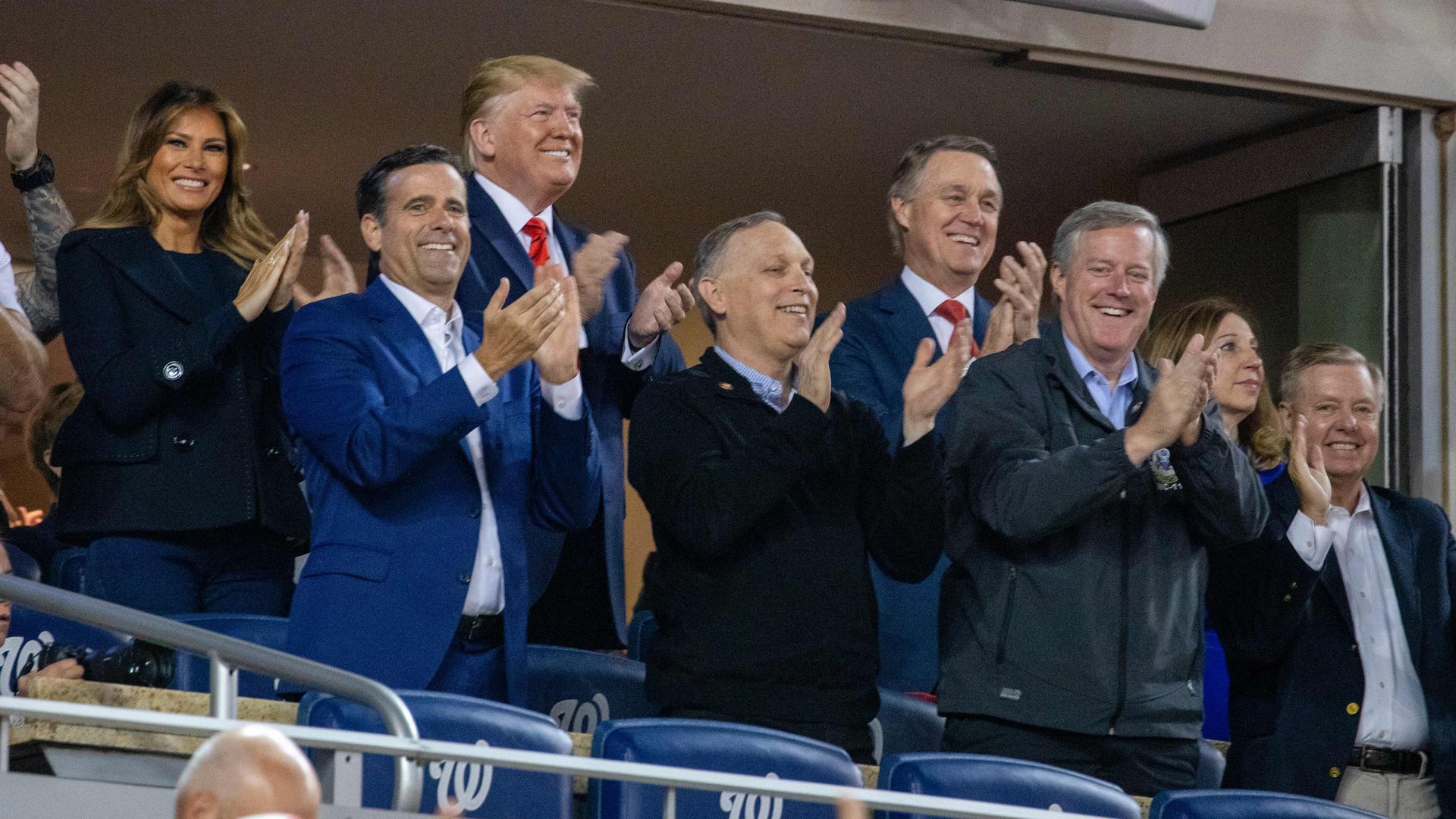 US President Donald Trump (C) and First Lady Melania Trump (2L) with Republican lawmakers during the World Series between the Washington Nationals and Houston Astros 