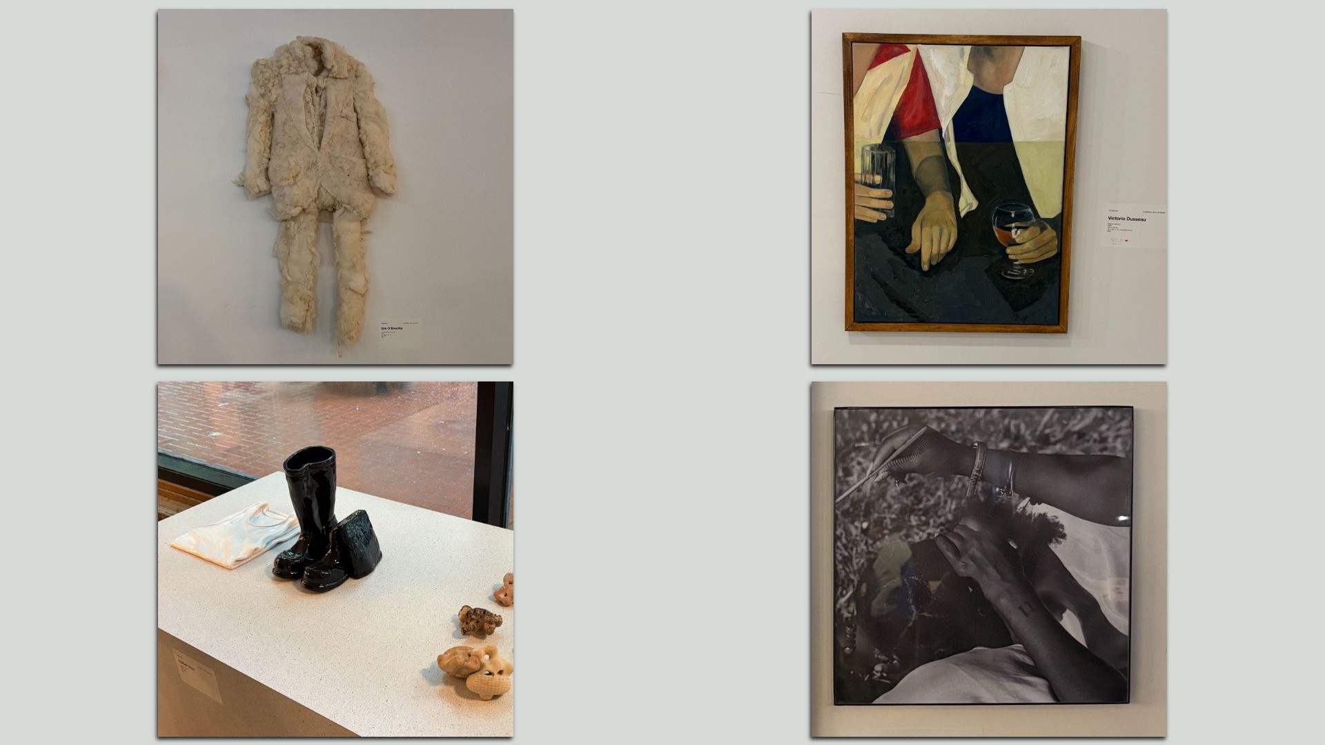 Gallery wall with four artworks: top-left beige plush suit sculpture; top-right framed geometric painting of people with drinks; bottom-left table scene featuring black glossy boots; bottom-right black-and-white photo of hands.