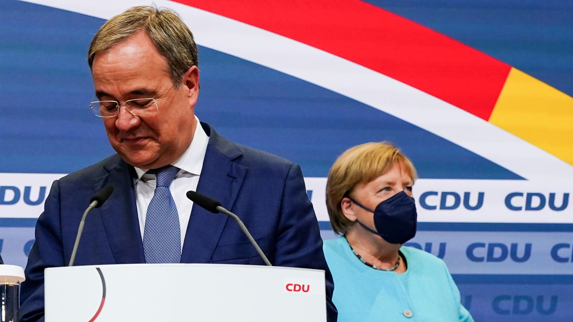 Christian Democratic Union (CDU) party chairman and candidate for the federal elections, Armin Laschet, in front of German Chancellor Angela Merkel on Sept. 26.