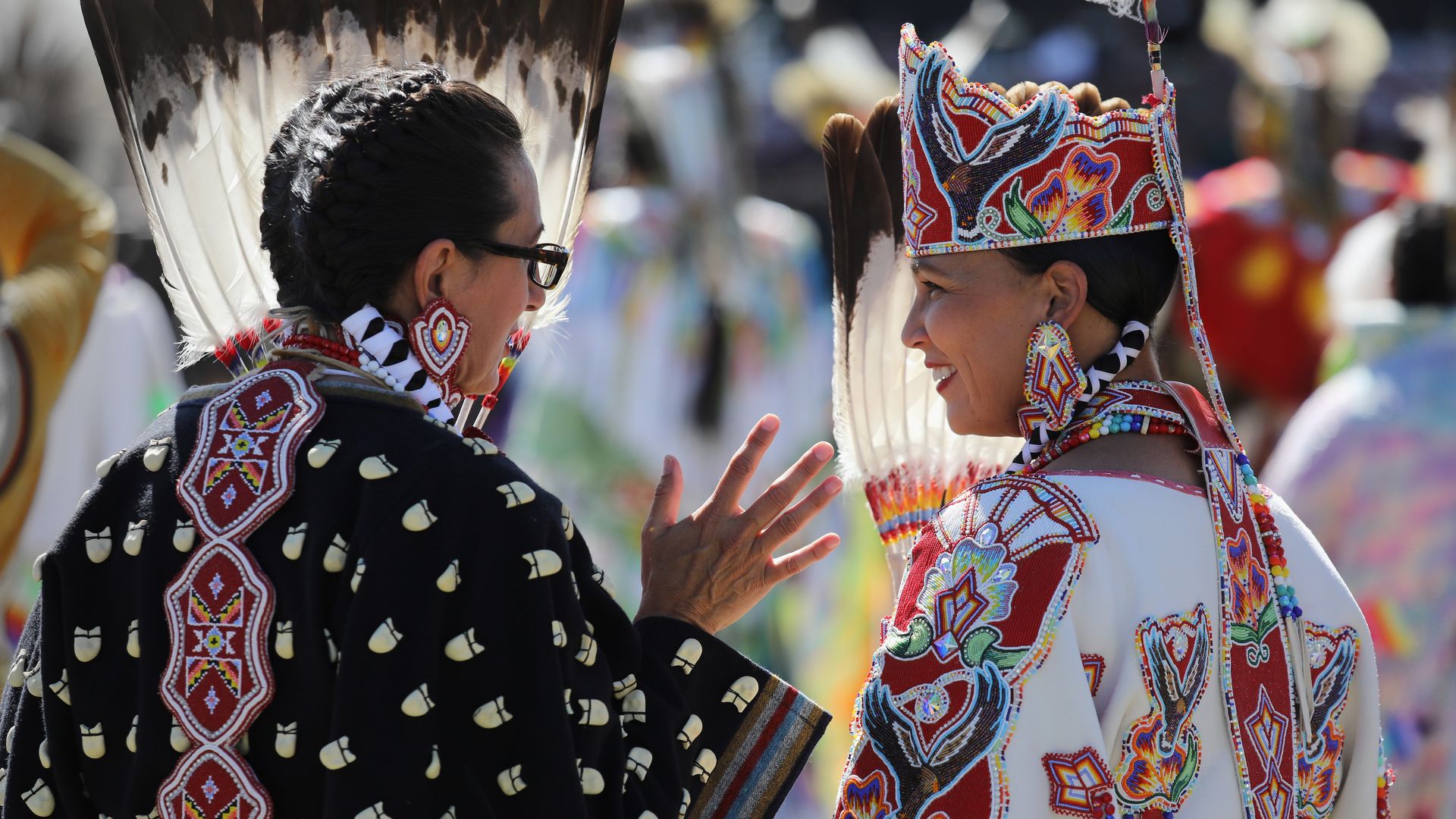Two Native American women in traditional garments