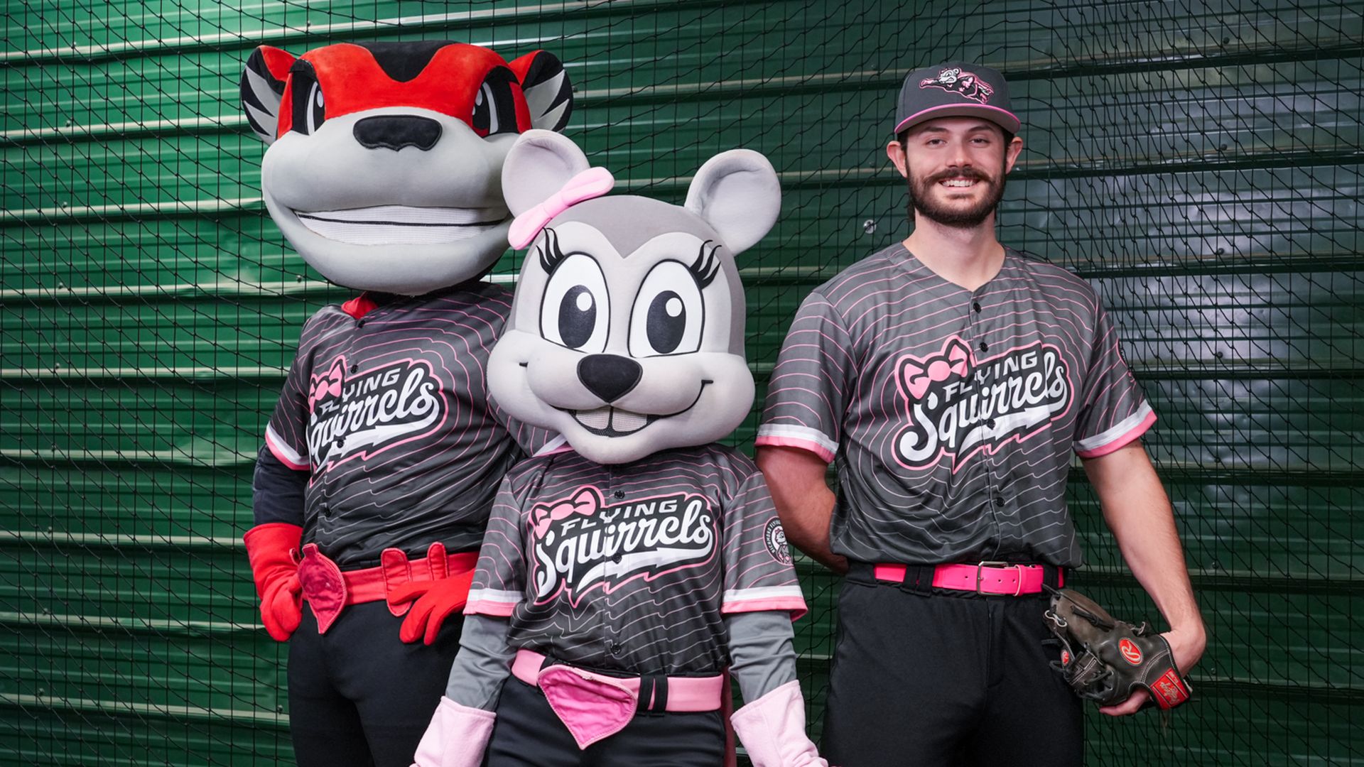 Nutzy, Nutusha and a player wearing the new Nustisha-themed uniforms, which are gray and pink 