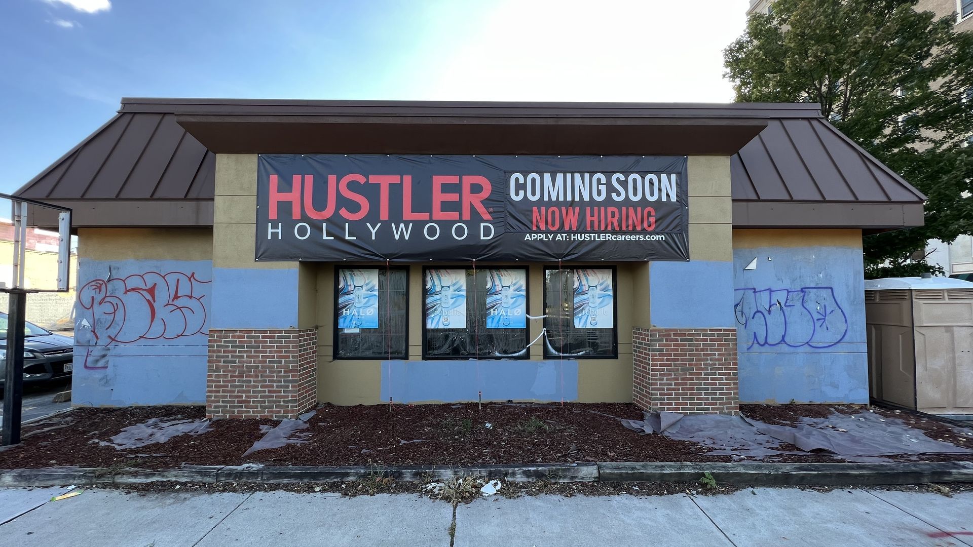 On old pizza hut with graffiti on it and a sign that says Hustler Hollywood coming soon 
