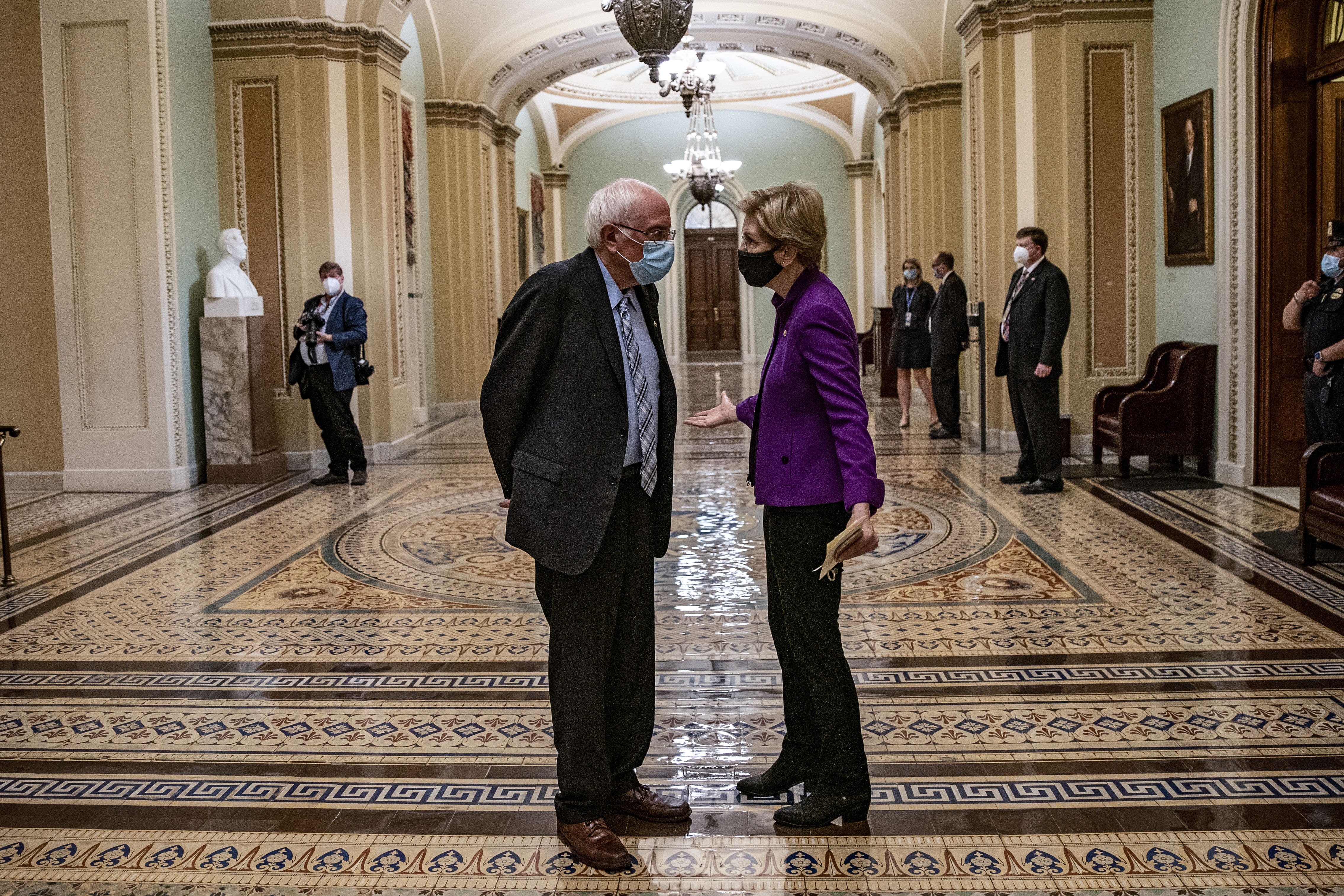  Sen. Bernie Sanders (I-VT) and Sen. Elizabeth Warren (D-MA) chat after U.S. President Joe Biden spoke at a joint session of Congress