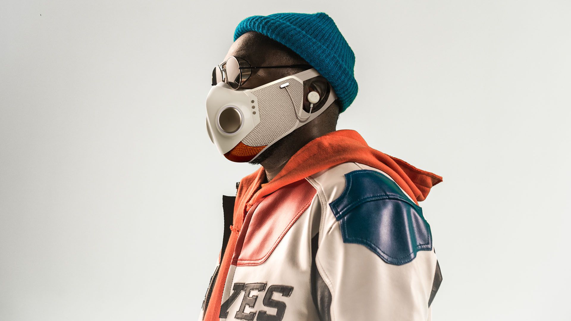 Shot of rapper will.i.am wearing his new mask, complete with airbuds