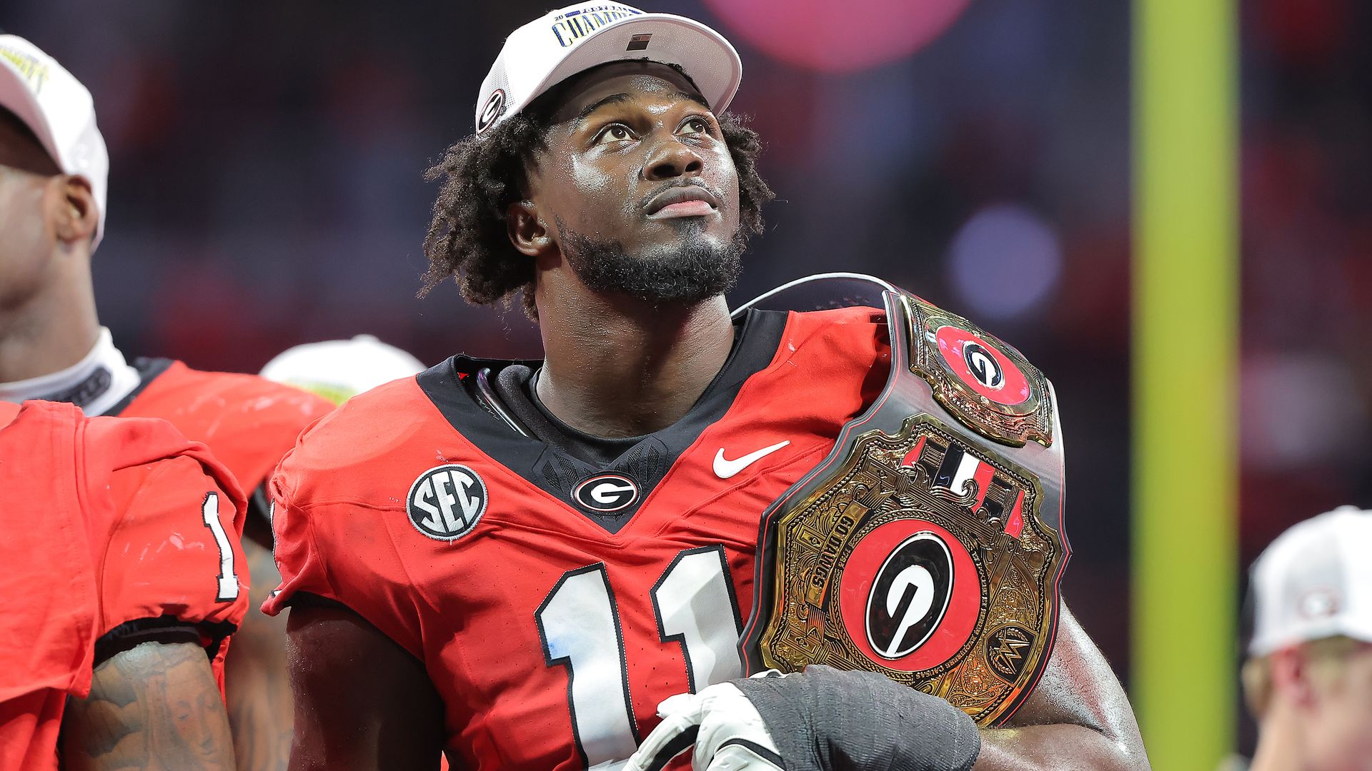 Georgia Bulldogs linebacker Jalon Walker (11) watches the Halo Board after the SEC championship football game between the Georgia Bulldogs and the Texas Longhorns on December 7, 2024 at the Mercedes-Benz Stadium in Atlanta, Georgia. (Photo by David J. Griffin/Icon Sportswire via Getty Images)