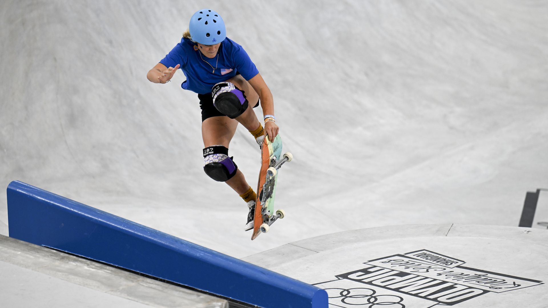 A skateboarder does a trick.