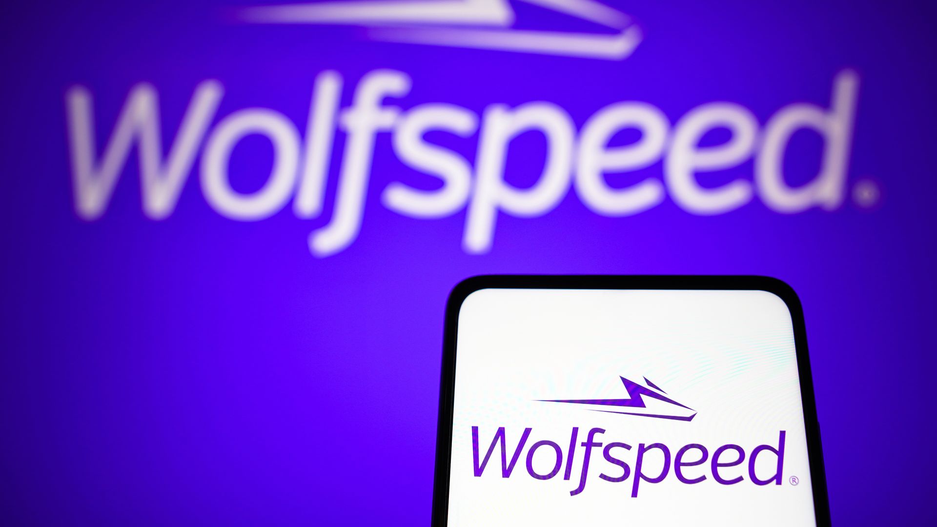The Wolfspeed logo on a purple background.