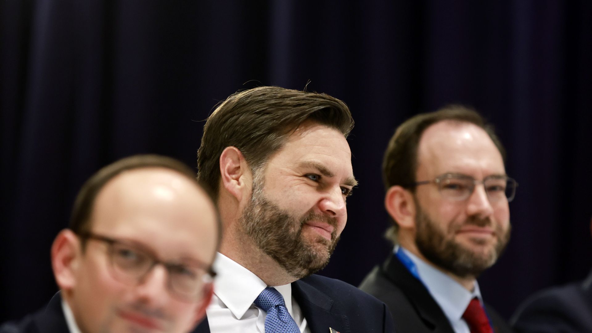 Andy Baker (right, with beard) advised Vice President Vance at the Munich Security Conference in Feb. 2025.