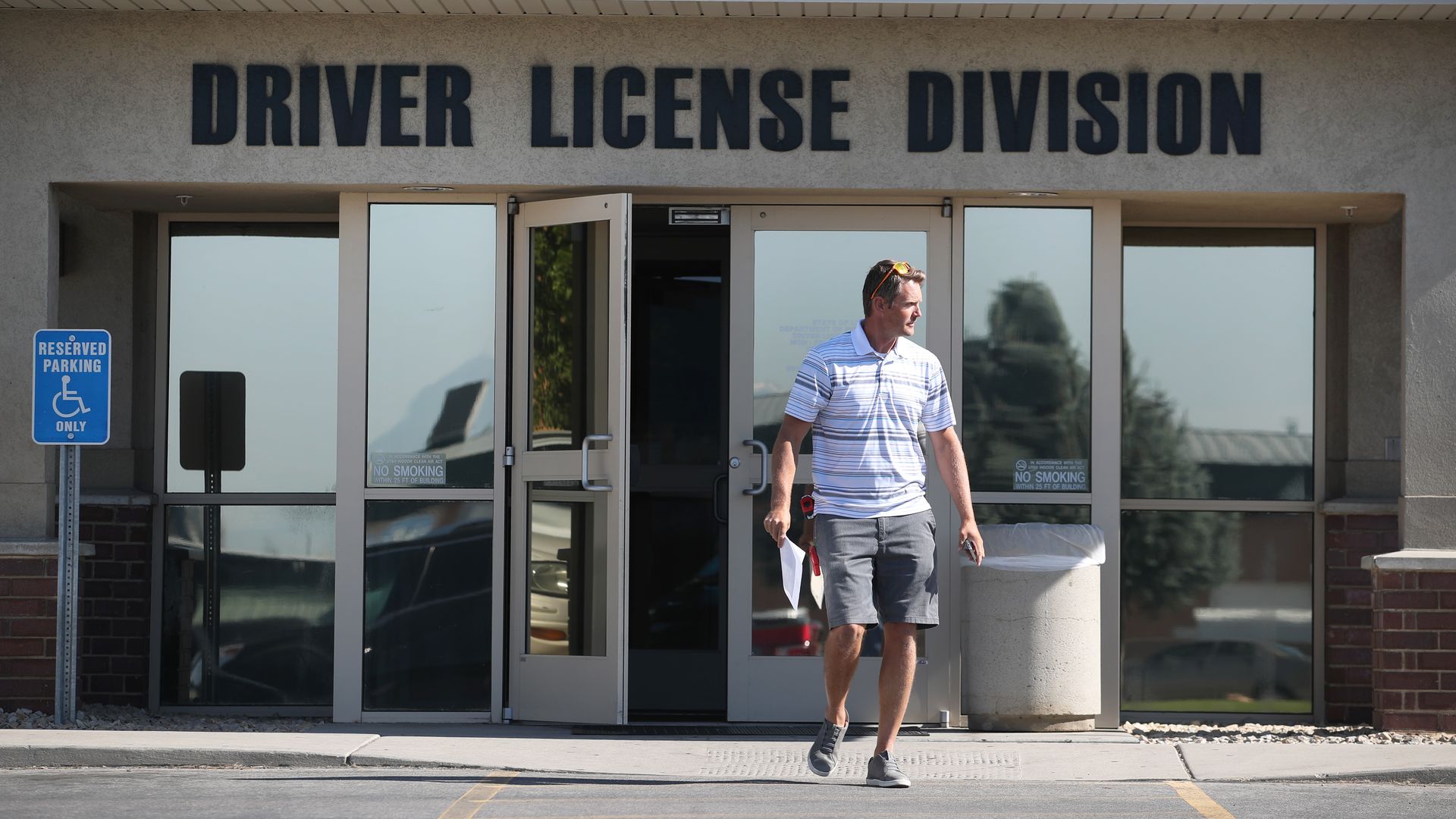 A man walking out of Driver License Division in Utah.