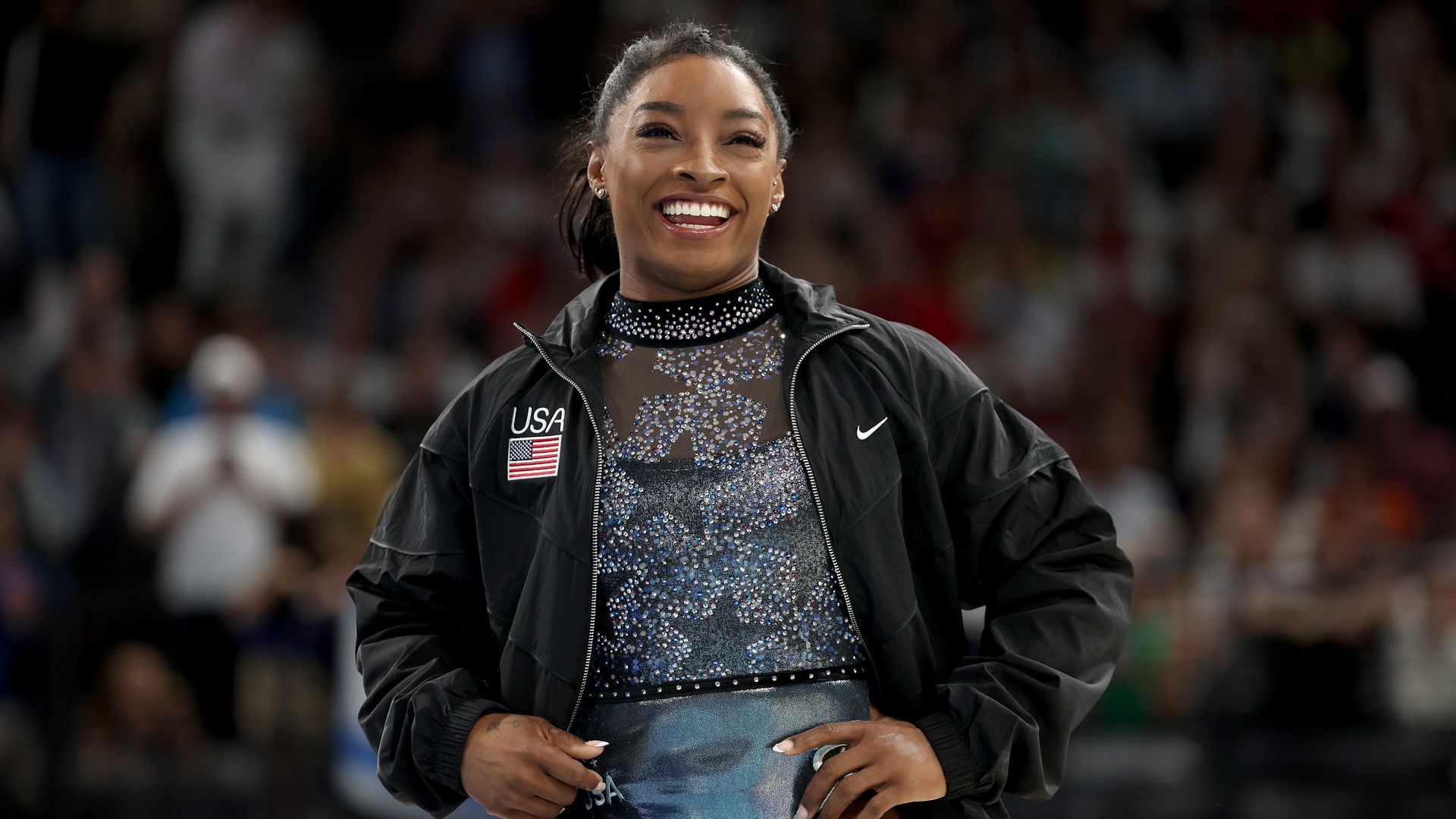 Simone Biles reacts as she arrives for the Artistic Gymnastics Women's Qualification on day two of the Olympic Games Paris 2024 at Bercy Arena on July 28, 2024 in Paris, France. (Photo by Jamie Squire/Getty Images)
