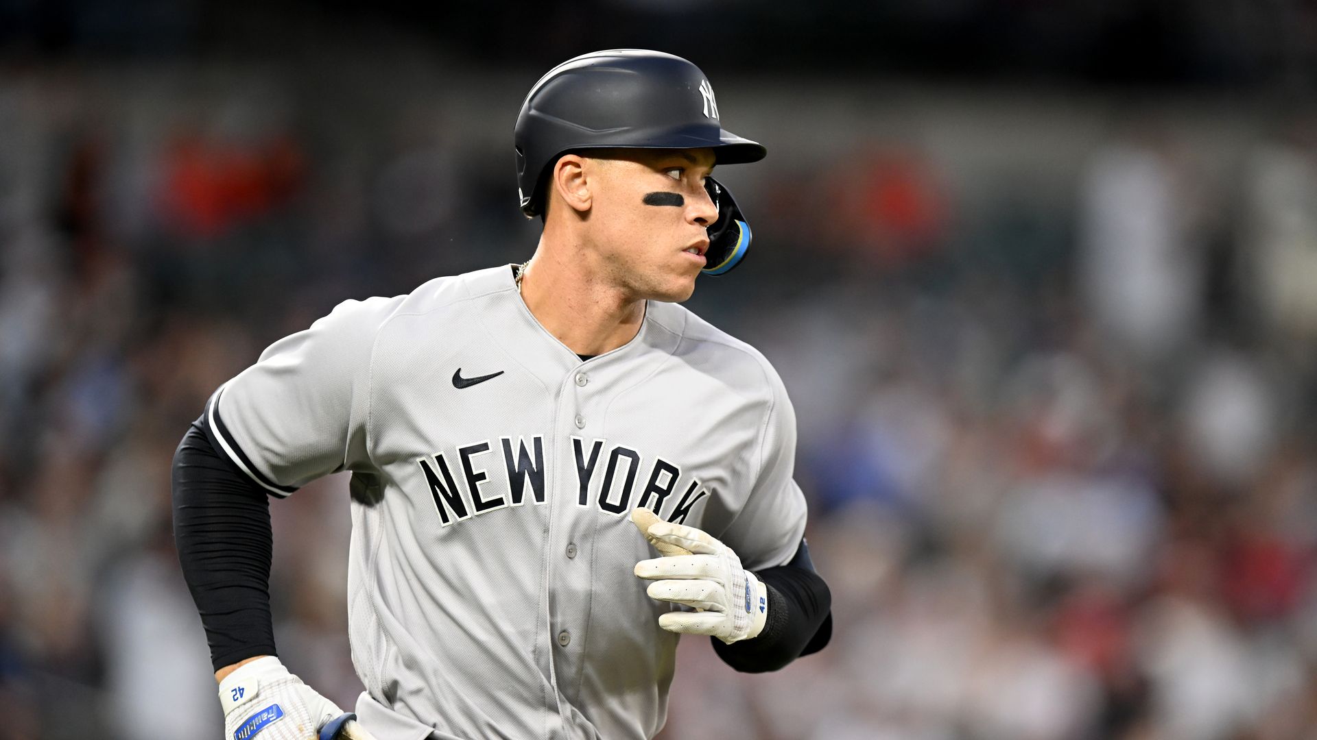 Aaron Judge, a professional baseball player for the New York Yankees, appears on field in the team's navy blue, grey and white uniform.