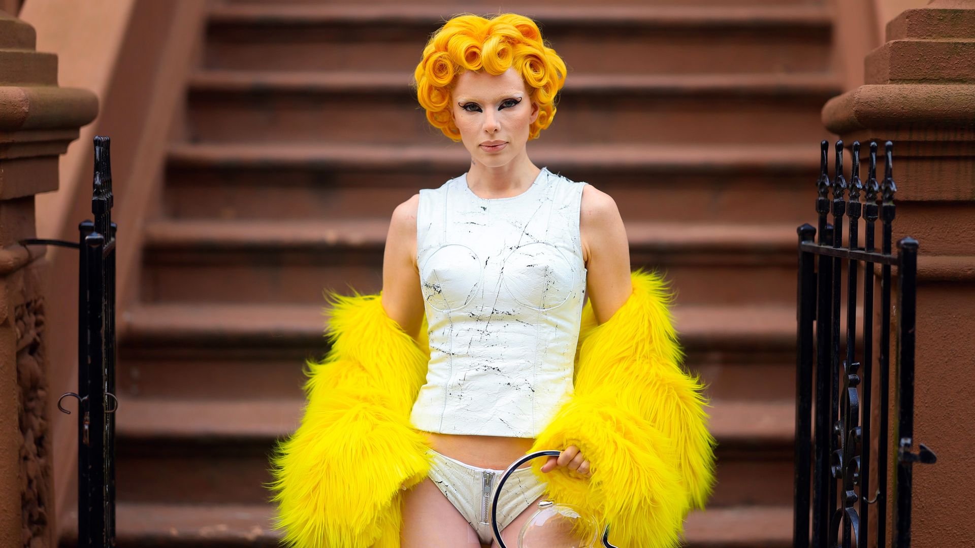 Actress Julia Fox is shown with bright gold hair.