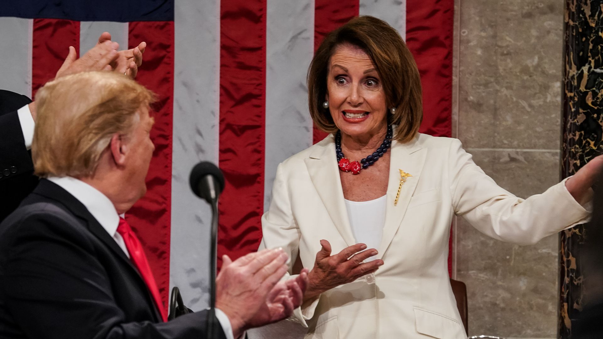  Speaker Nancy Pelosi gestures as President Donald Trump and Vice President Mike Pence applaud during the State of the Union address.