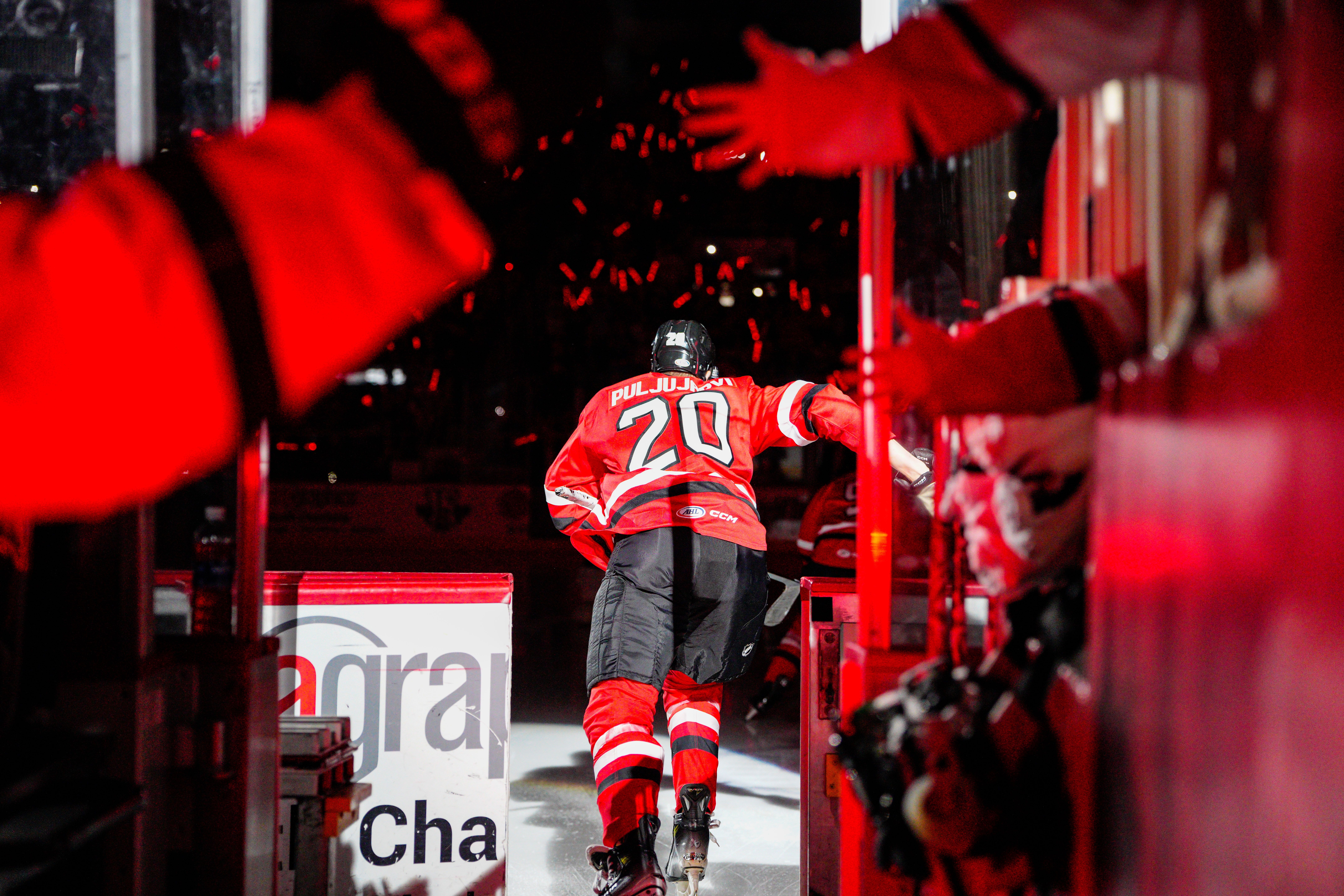 Checkers player skates out onto the ice.