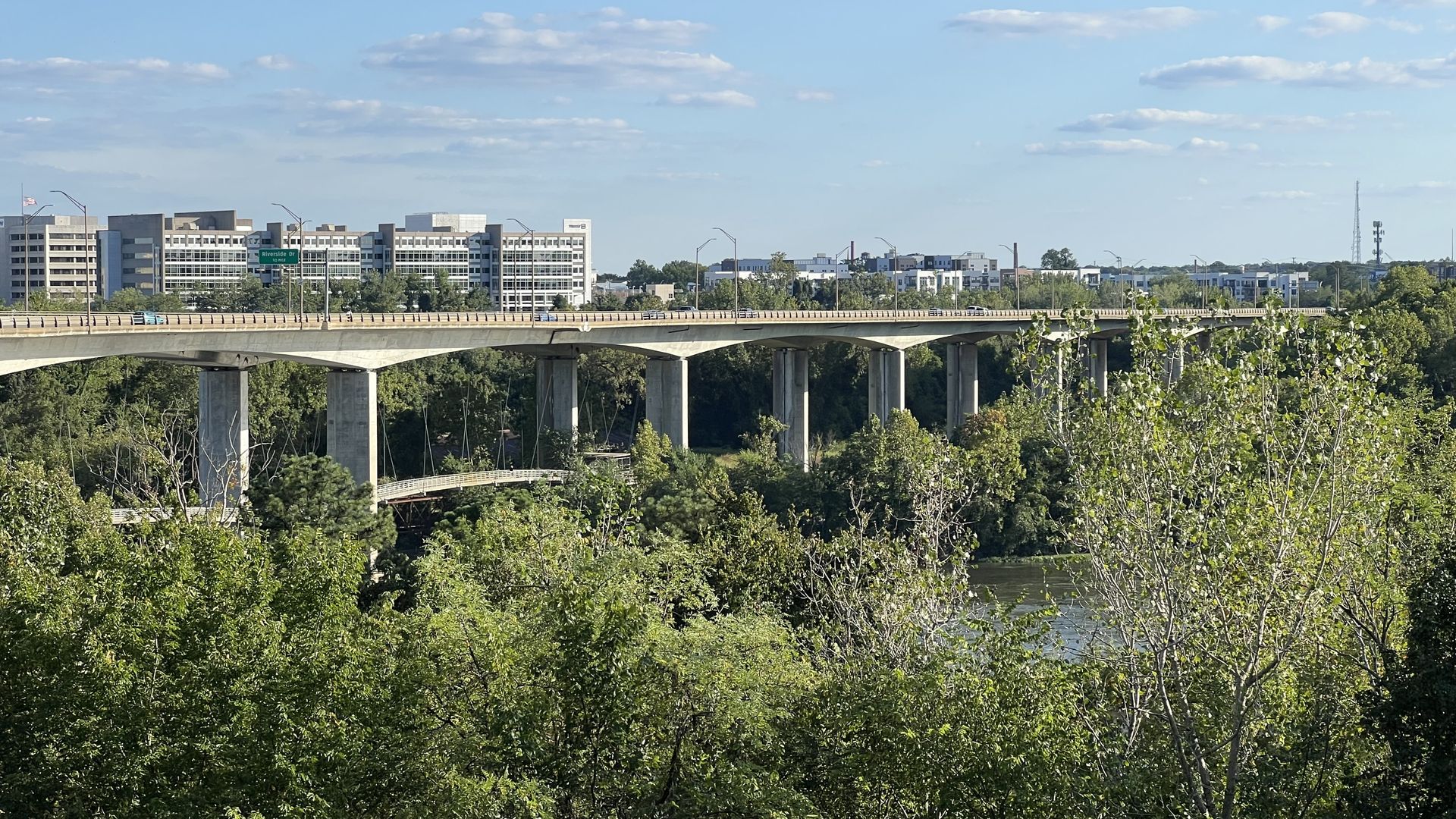 a bridge with the city in the background