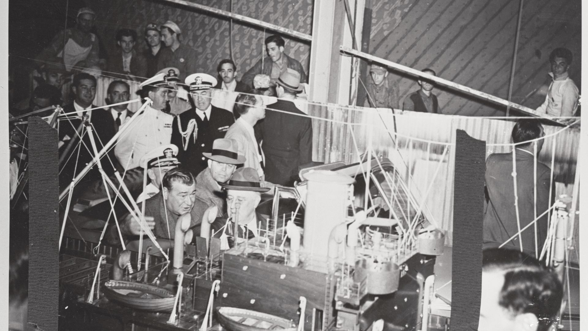 Photos shows President Eisenhower touring a ship-building facility in New Orleans with Andrew Higgins.